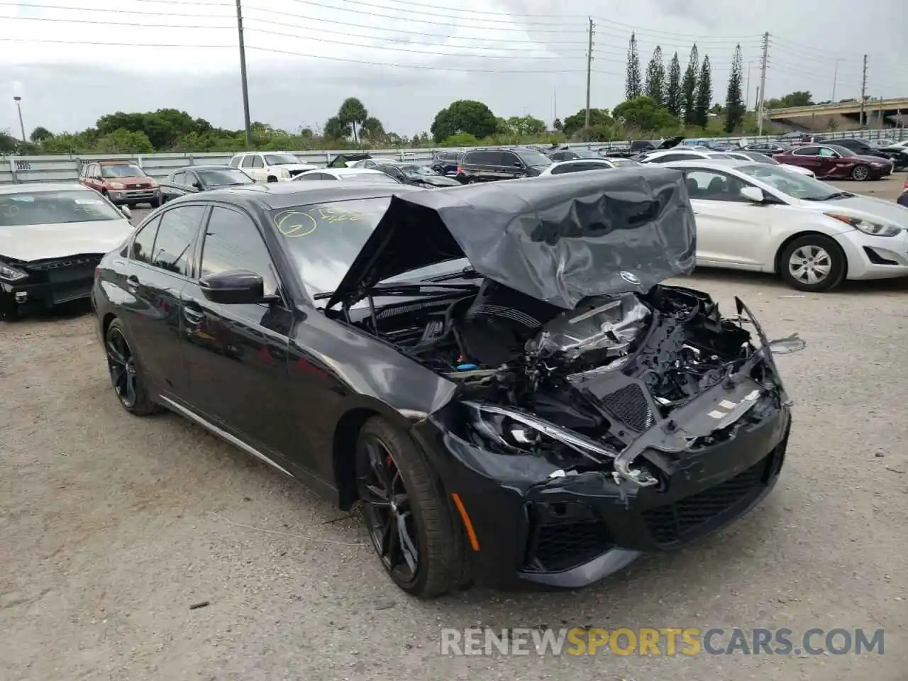 1 Photograph of a damaged car 3MW5U7J03N8C61389 BMW M3 2022