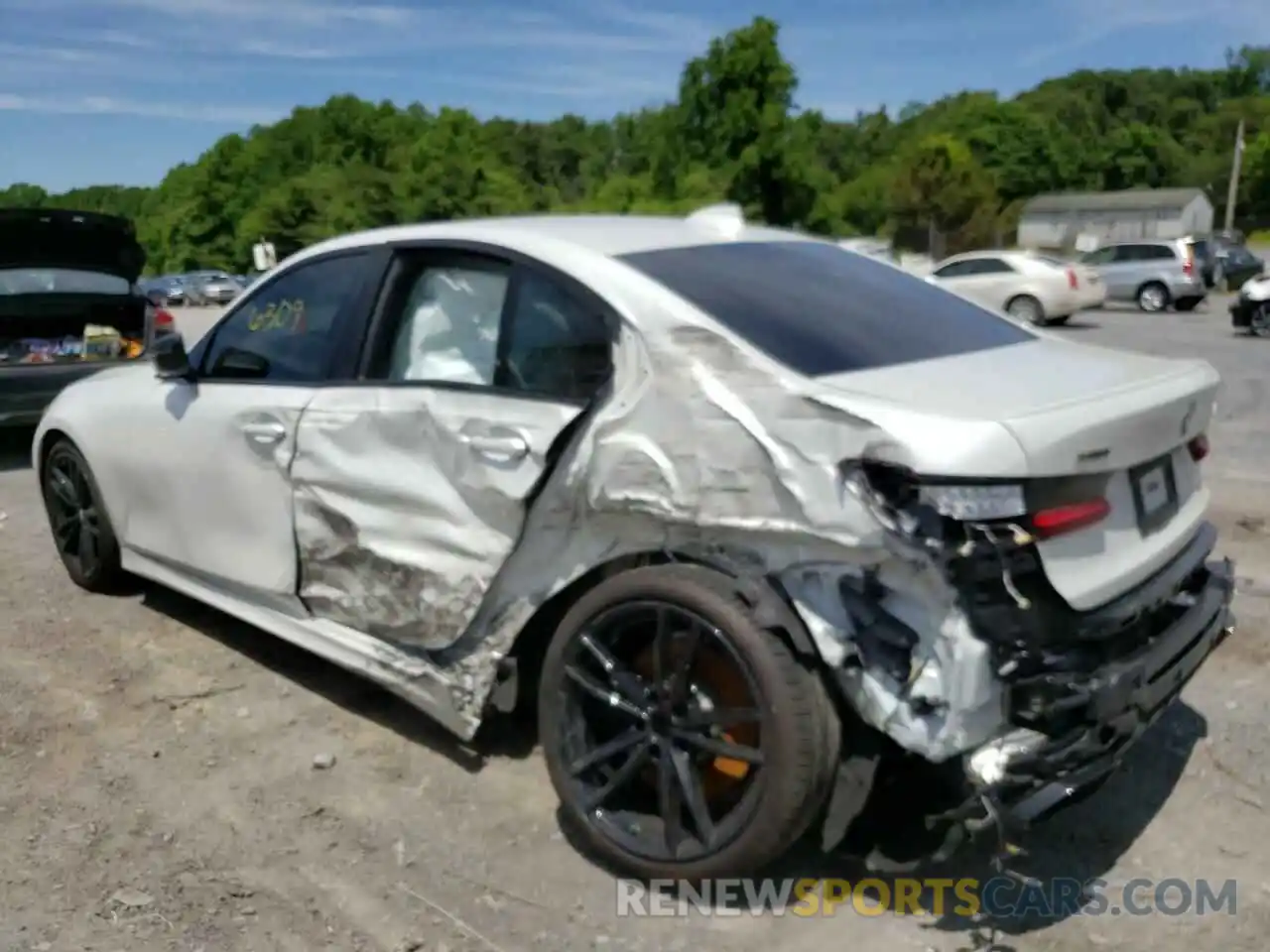 3 Photograph of a damaged car 3MW5U9J01N8C22764 BMW M3 2022