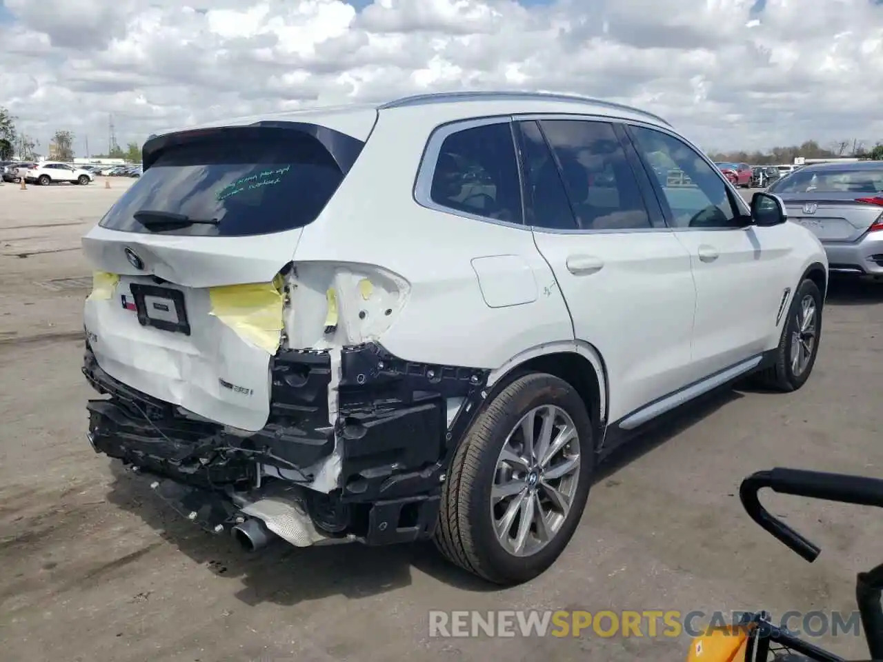 4 Photograph of a damaged car 5UXTR7C5XKLF32135 BMW X3 2019