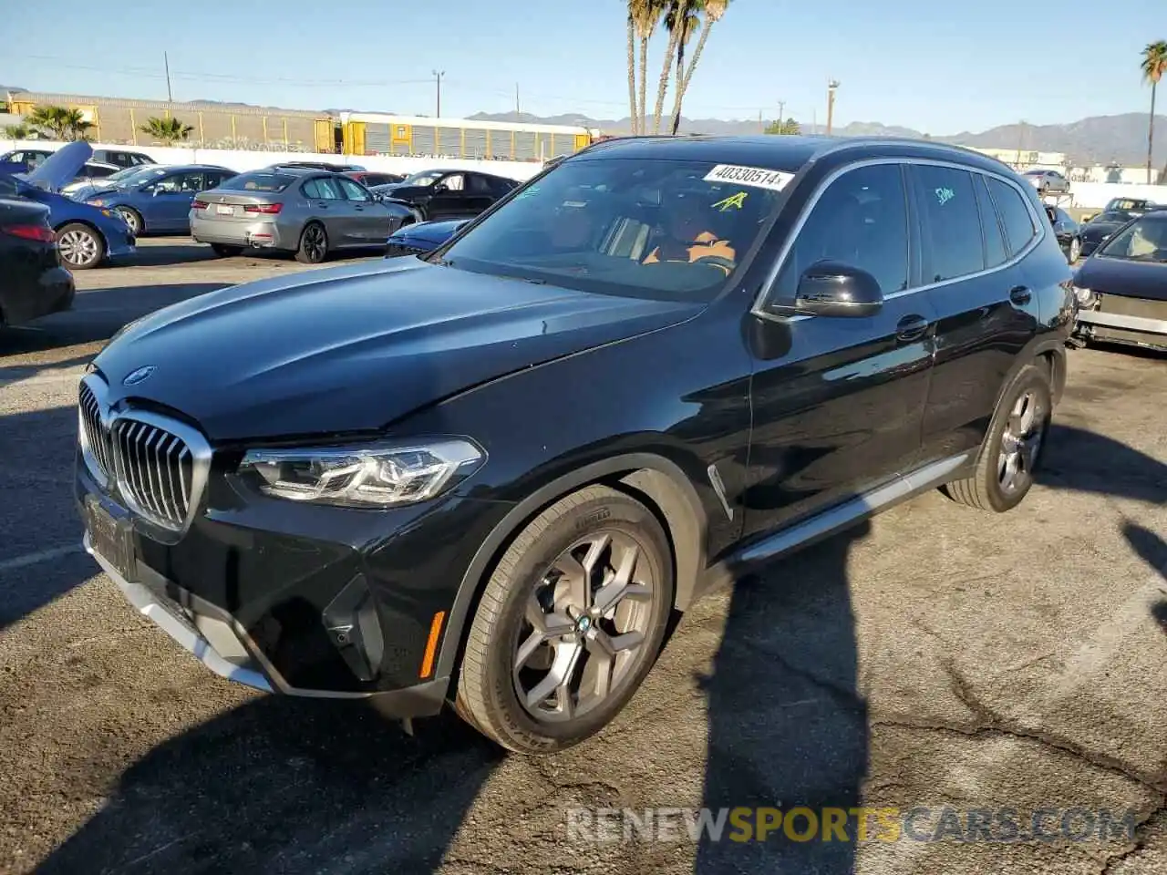 1 Photograph of a damaged car 5UX43DP03N9L47832 BMW X3 2022