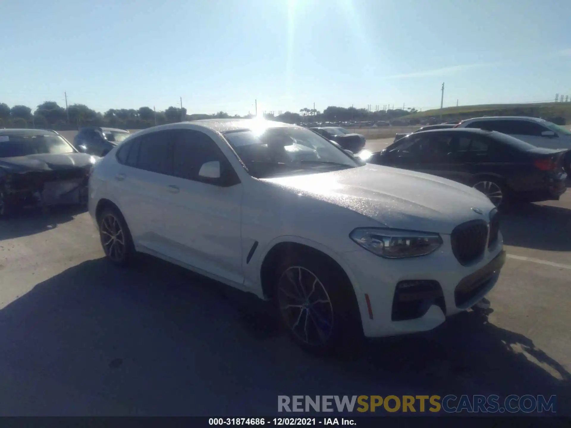 1 Photograph of a damaged car 5UX2V1C05M9H34129 BMW X4 2021