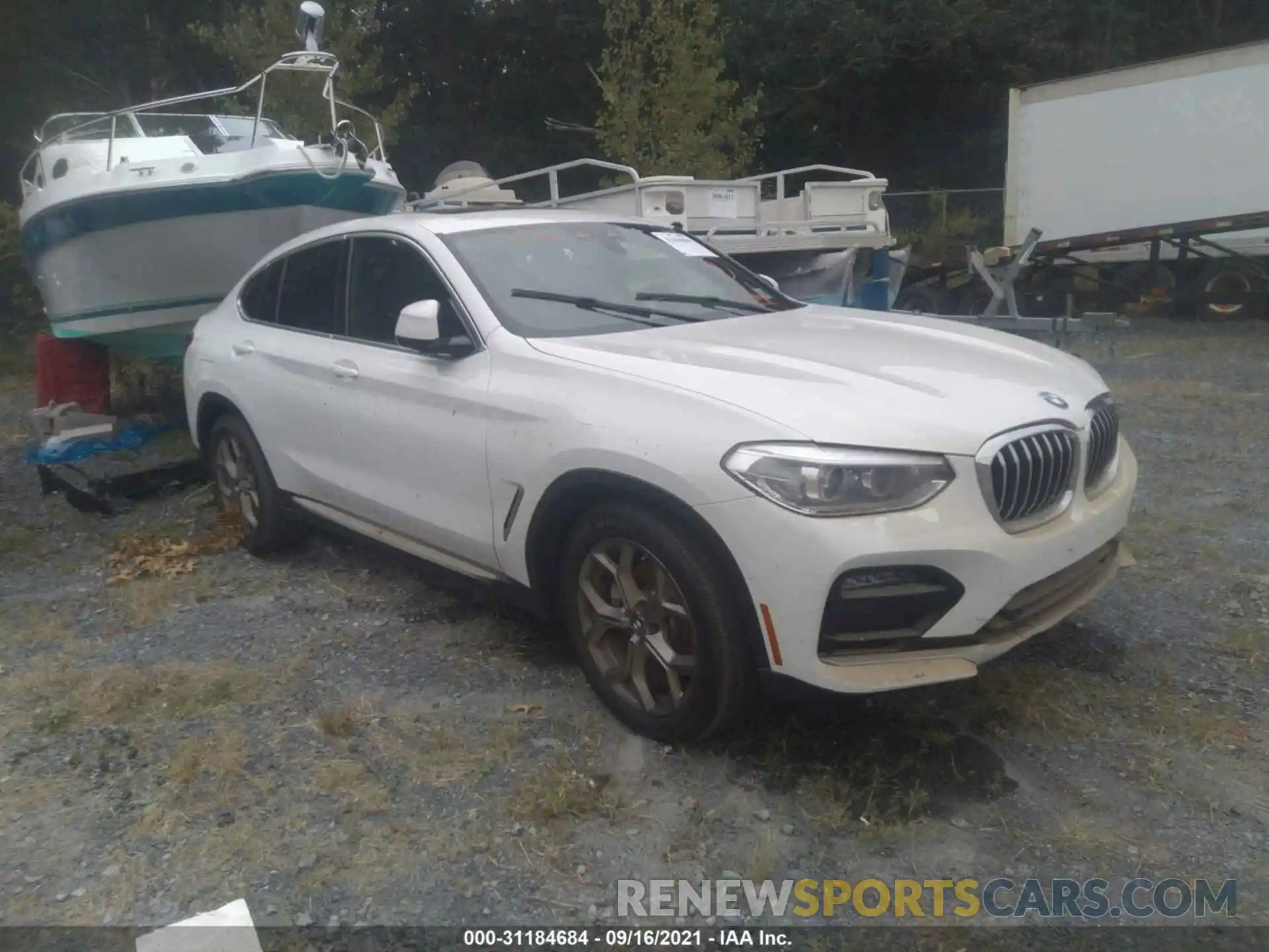 1 Photograph of a damaged car 5UX2V1C09M9G26144 BMW X4 2021