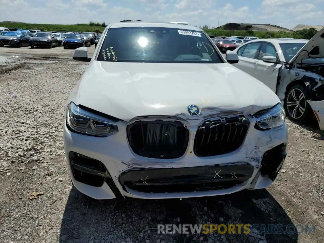 9 Photograph of a damaged car 5UX2V5C07M9D75714 BMW X4 2021