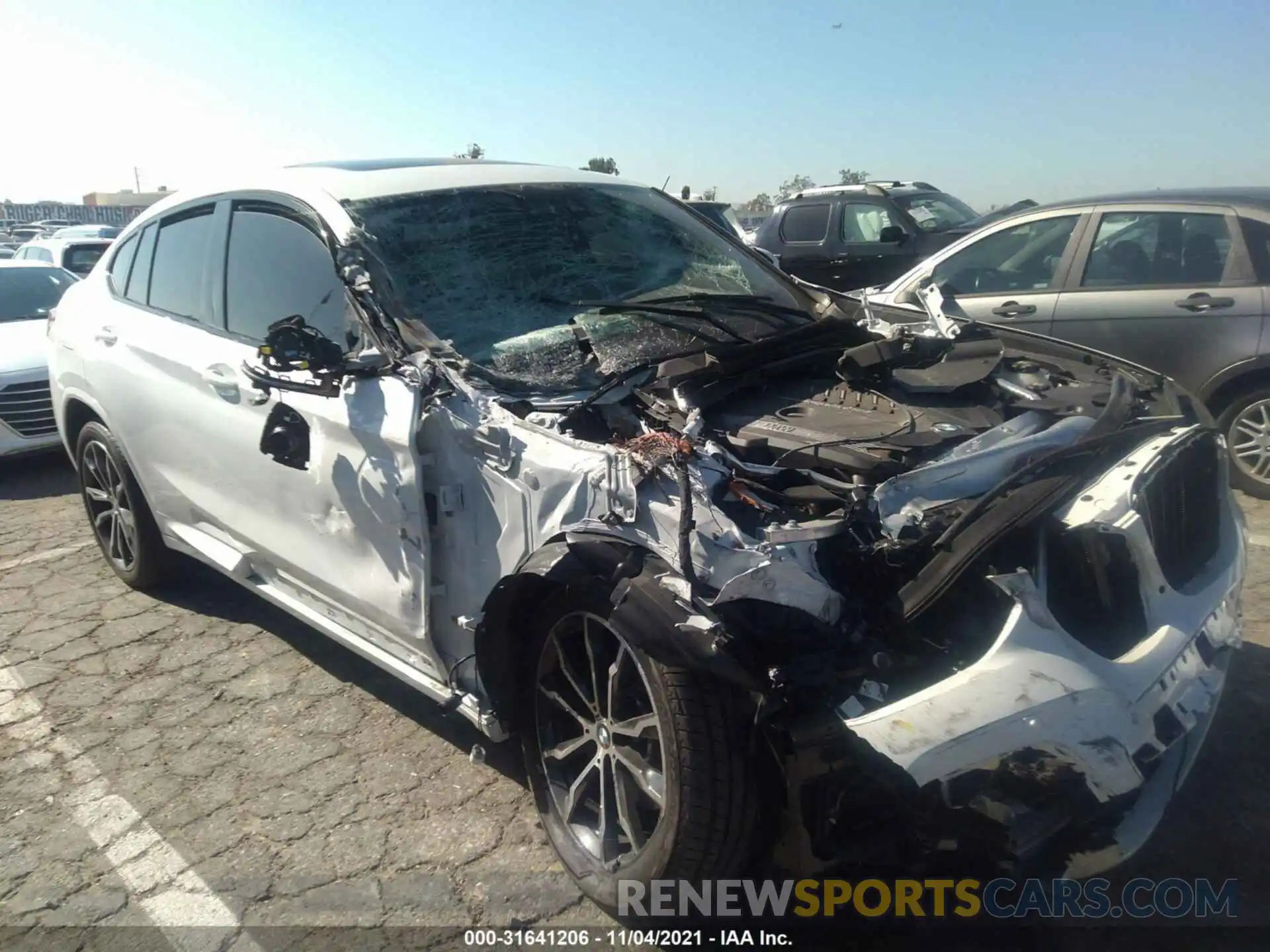 1 Photograph of a damaged car 5UX2V5C09M9G57675 BMW X4 2021