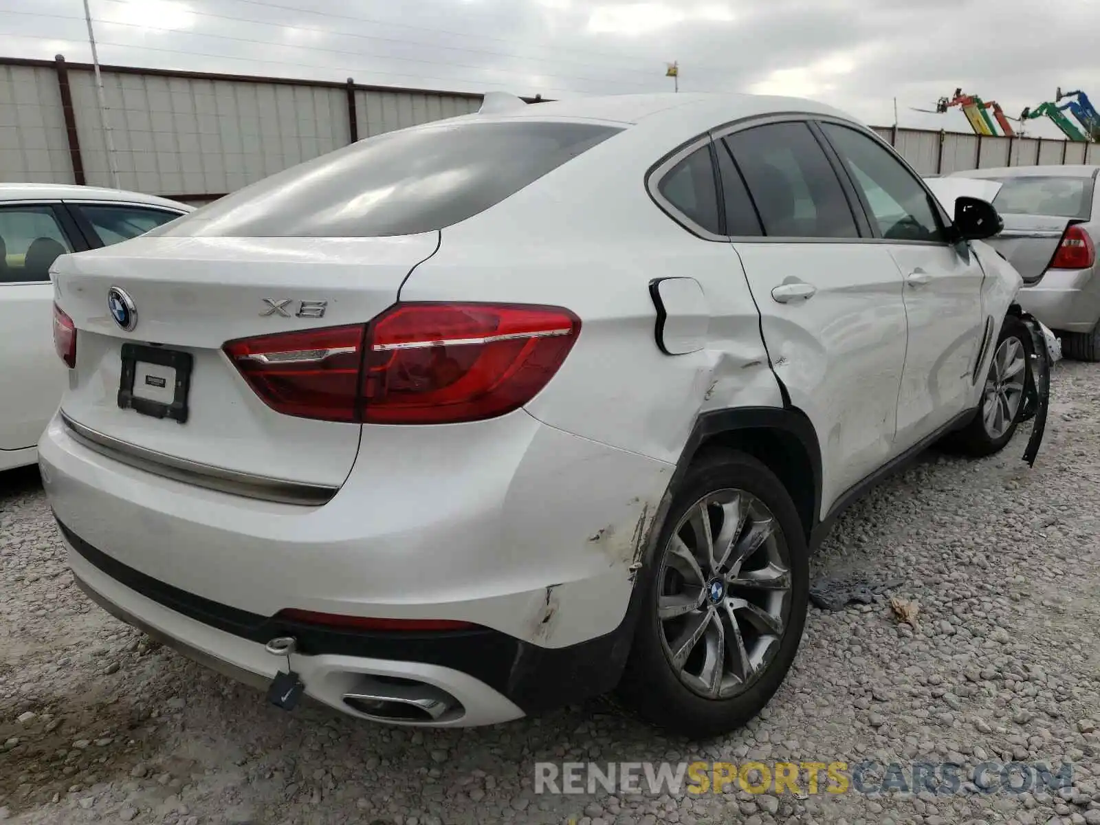 4 Photograph of a damaged car 5UXKU2C5XK0Z65451 BMW X6 2019