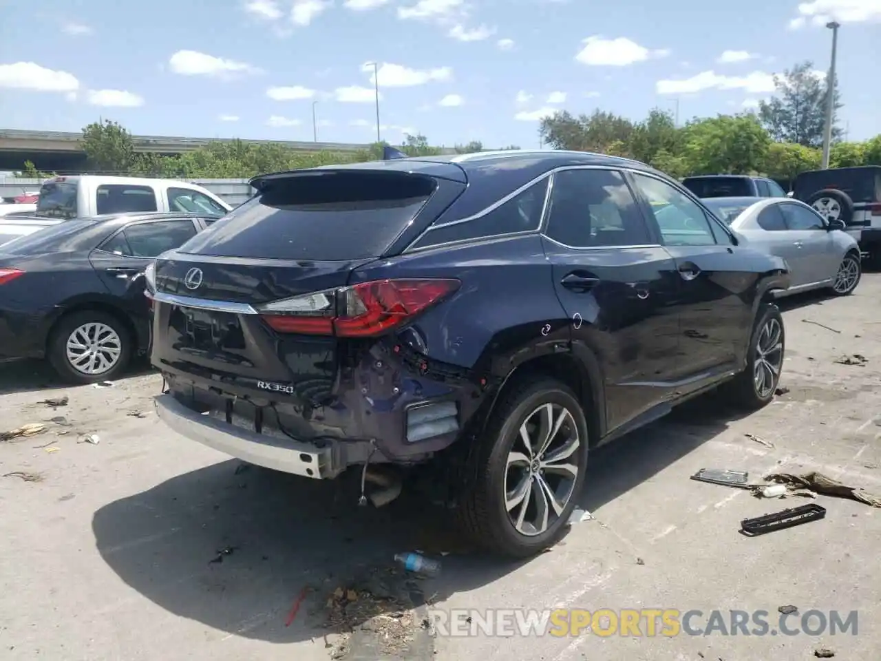 4 Photograph of a damaged car 2T2ZZMCA0KC128171 LEXUS RX350 2019