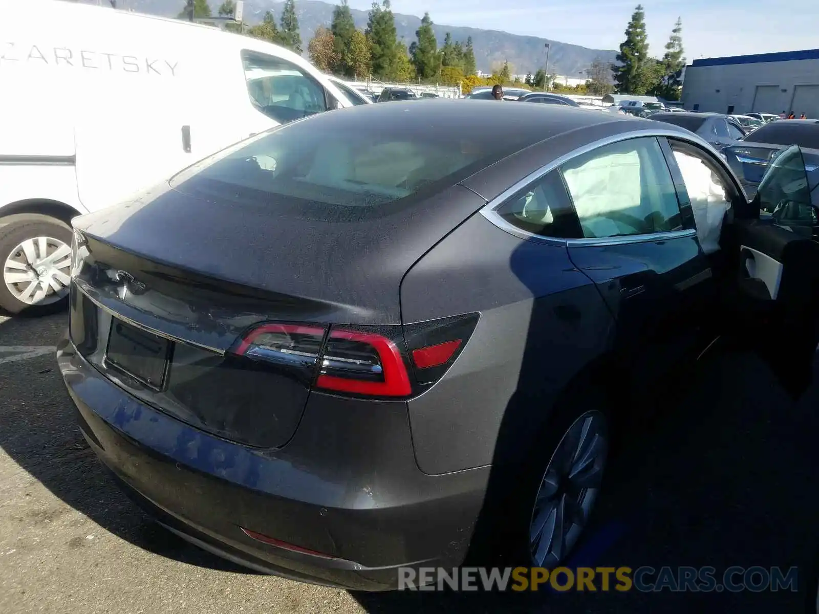 4 Photograph of a damaged car 5YJ3E1EA2KF543036 TESLA MODEL 3 2019