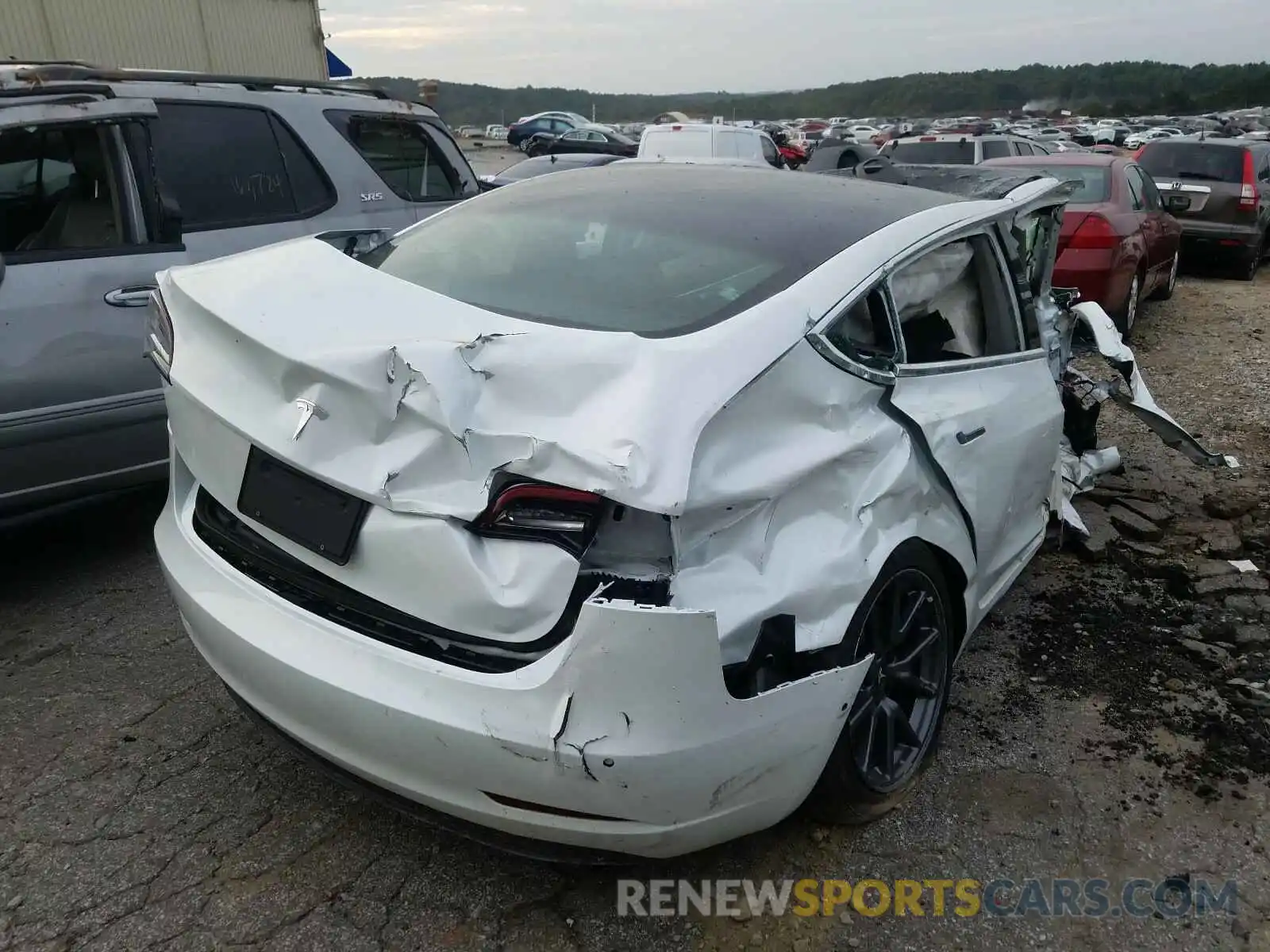 4 Photograph of a damaged car 5YJ3E1EA0LF504141 TESLA MODEL 3 2020