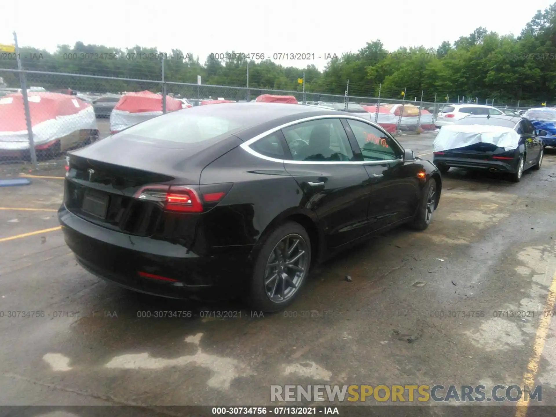 4 Photograph of a damaged car 5YJ3E1EA0LF657456 TESLA MODEL 3 2020