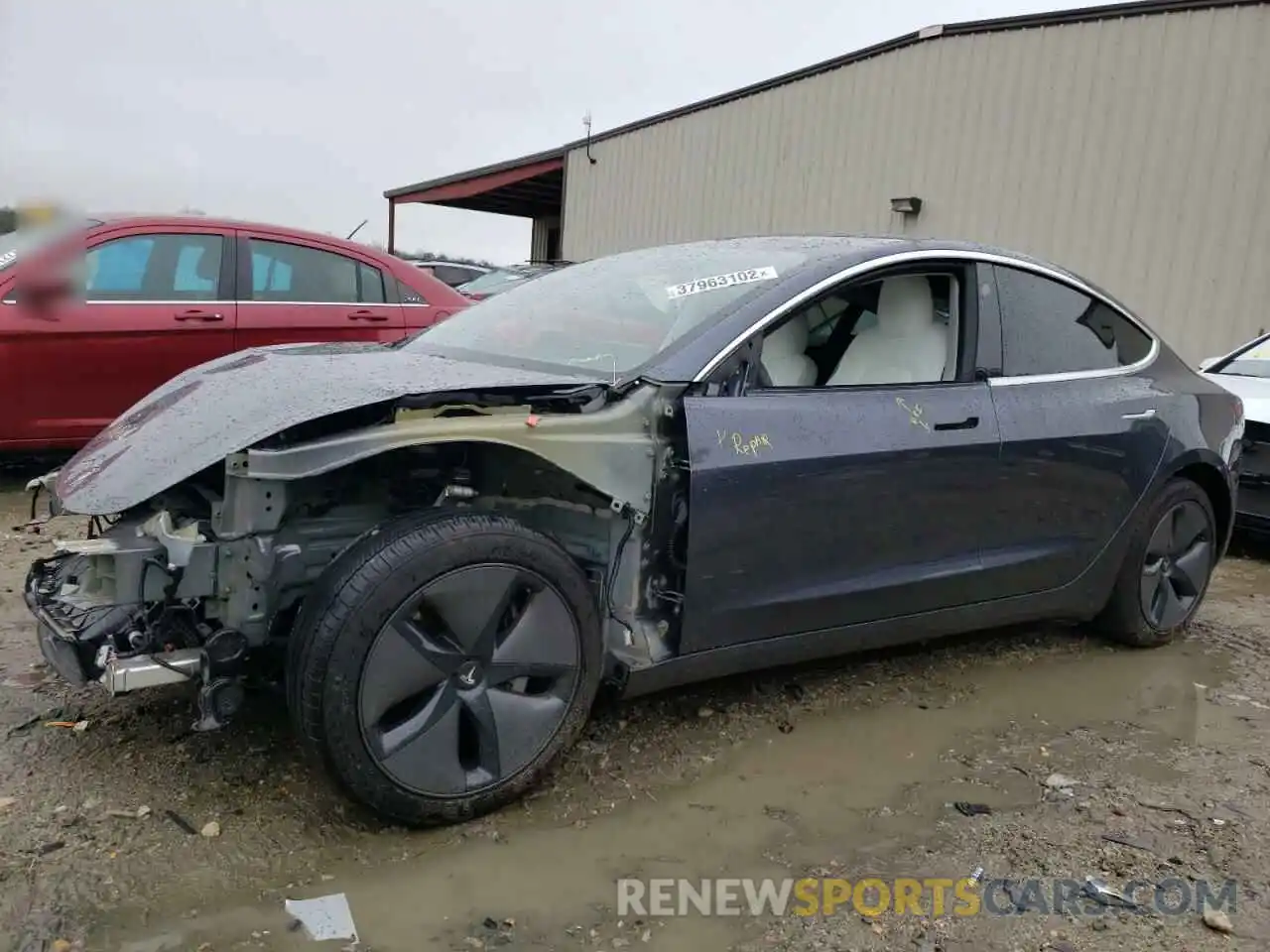 2 Photograph of a damaged car 5YJ3E1EA0LF738134 TESLA MODEL 3 2020