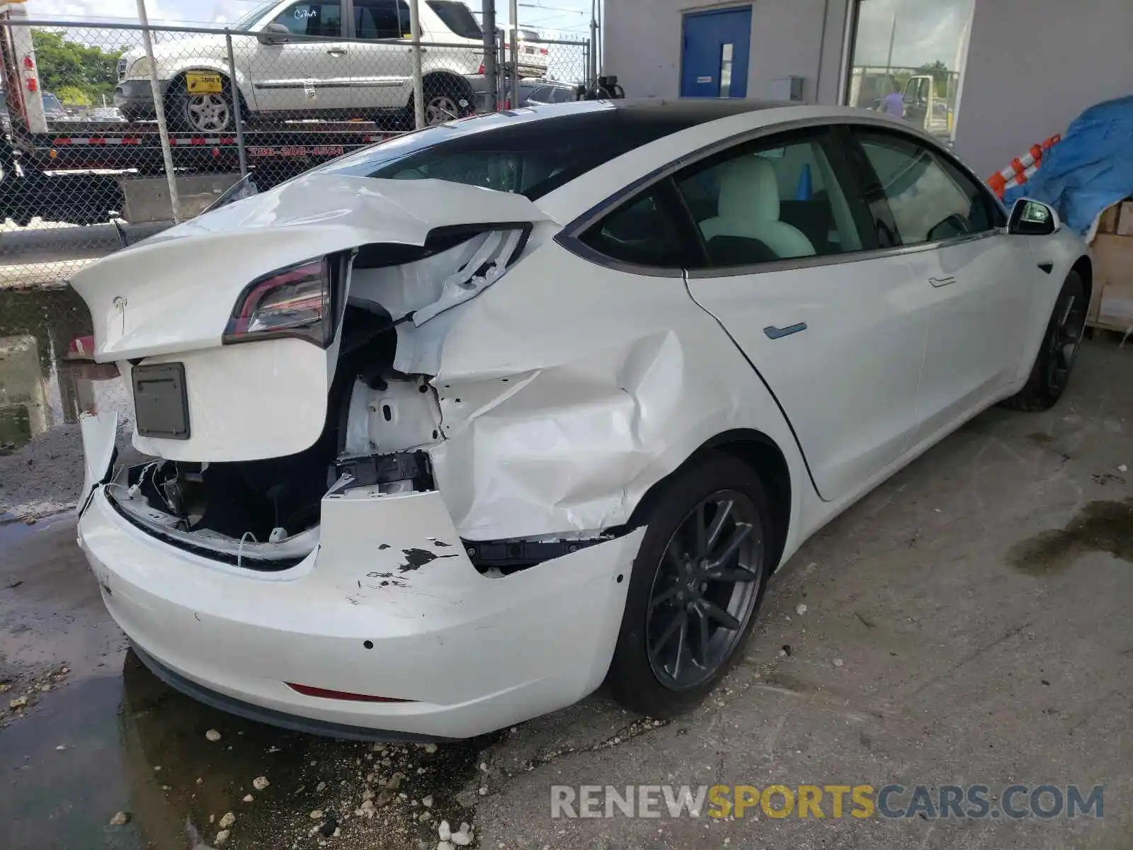 4 Photograph of a damaged car 5YJ3E1EA1LF599129 TESLA MODEL 3 2020