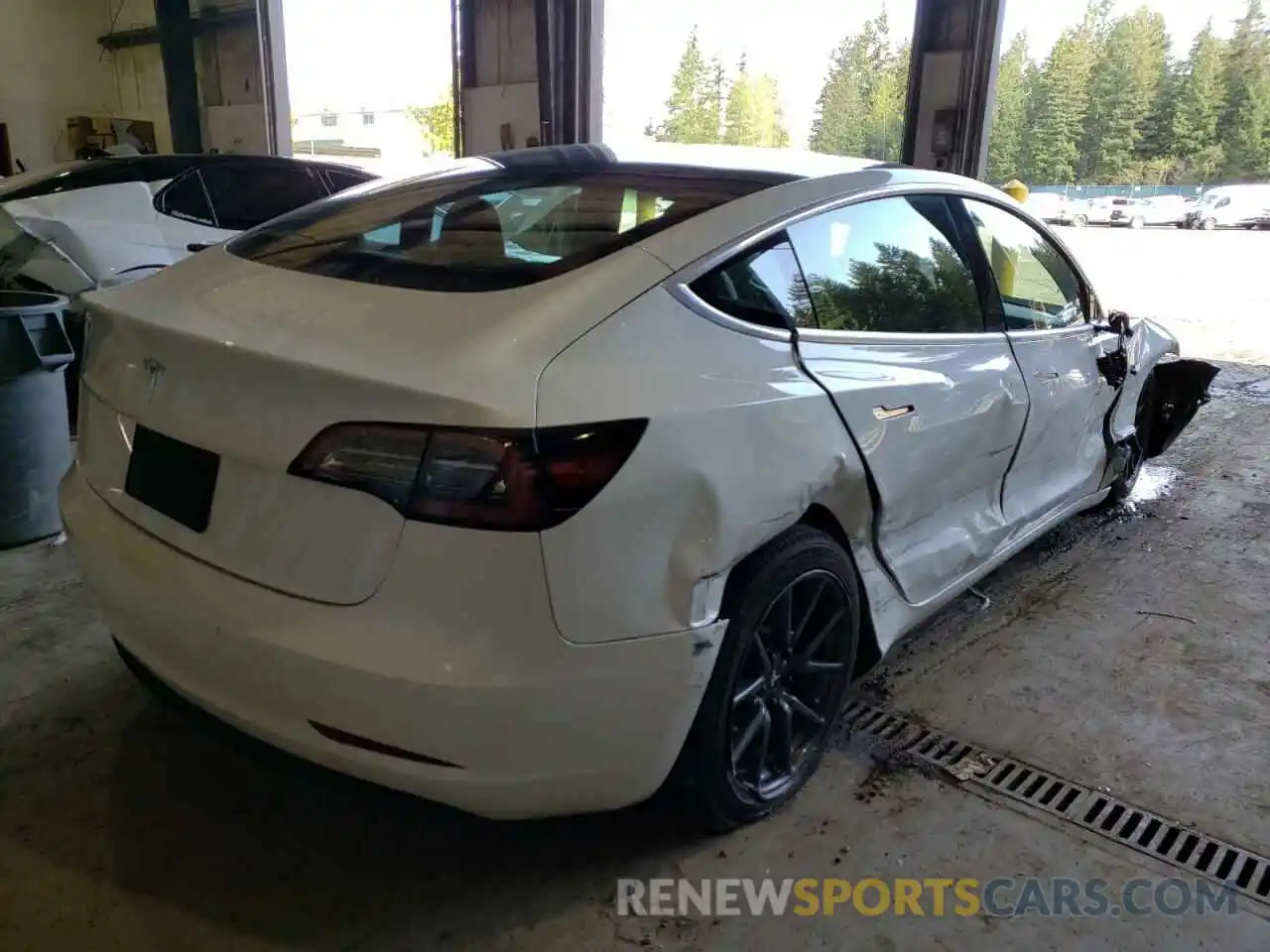 4 Photograph of a damaged car 5YJ3E1EA1LF740118 TESLA MODEL 3 2020