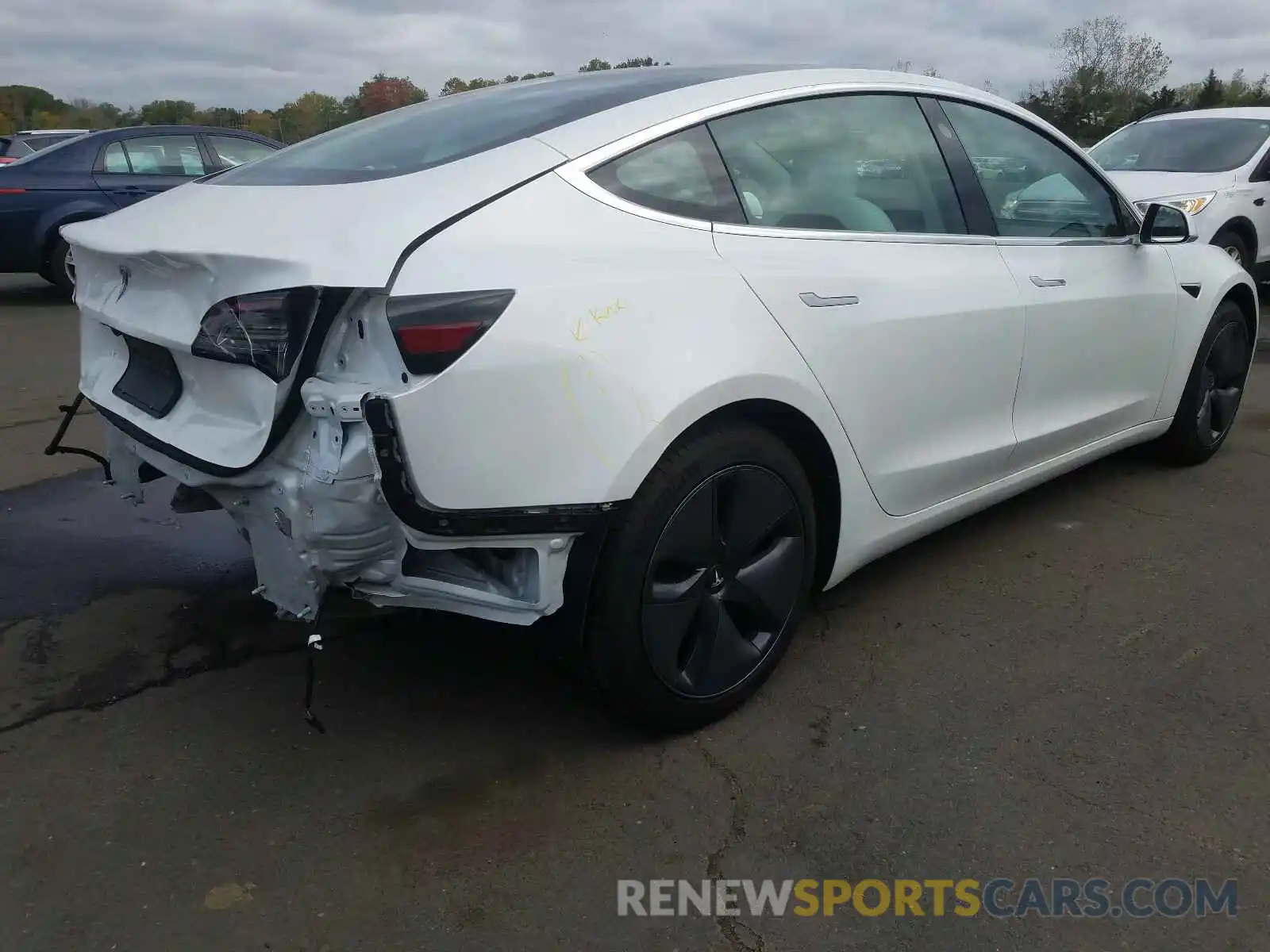 4 Photograph of a damaged car 5YJ3E1EA2LF746087 TESLA MODEL 3 2020