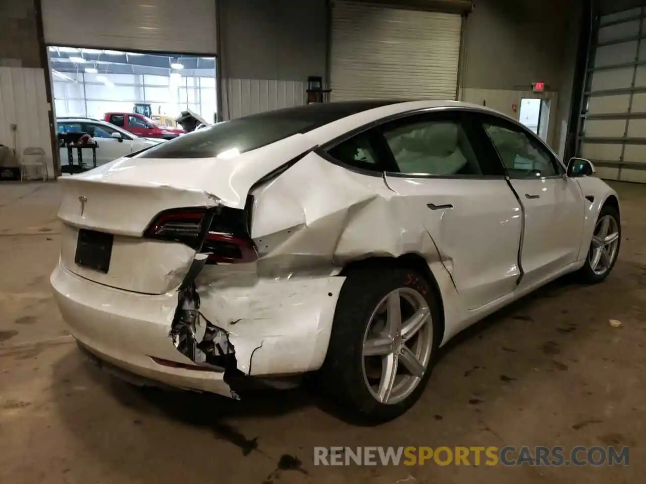 4 Photograph of a damaged car 5YJ3E1EA2LF797962 TESLA MODEL 3 2020