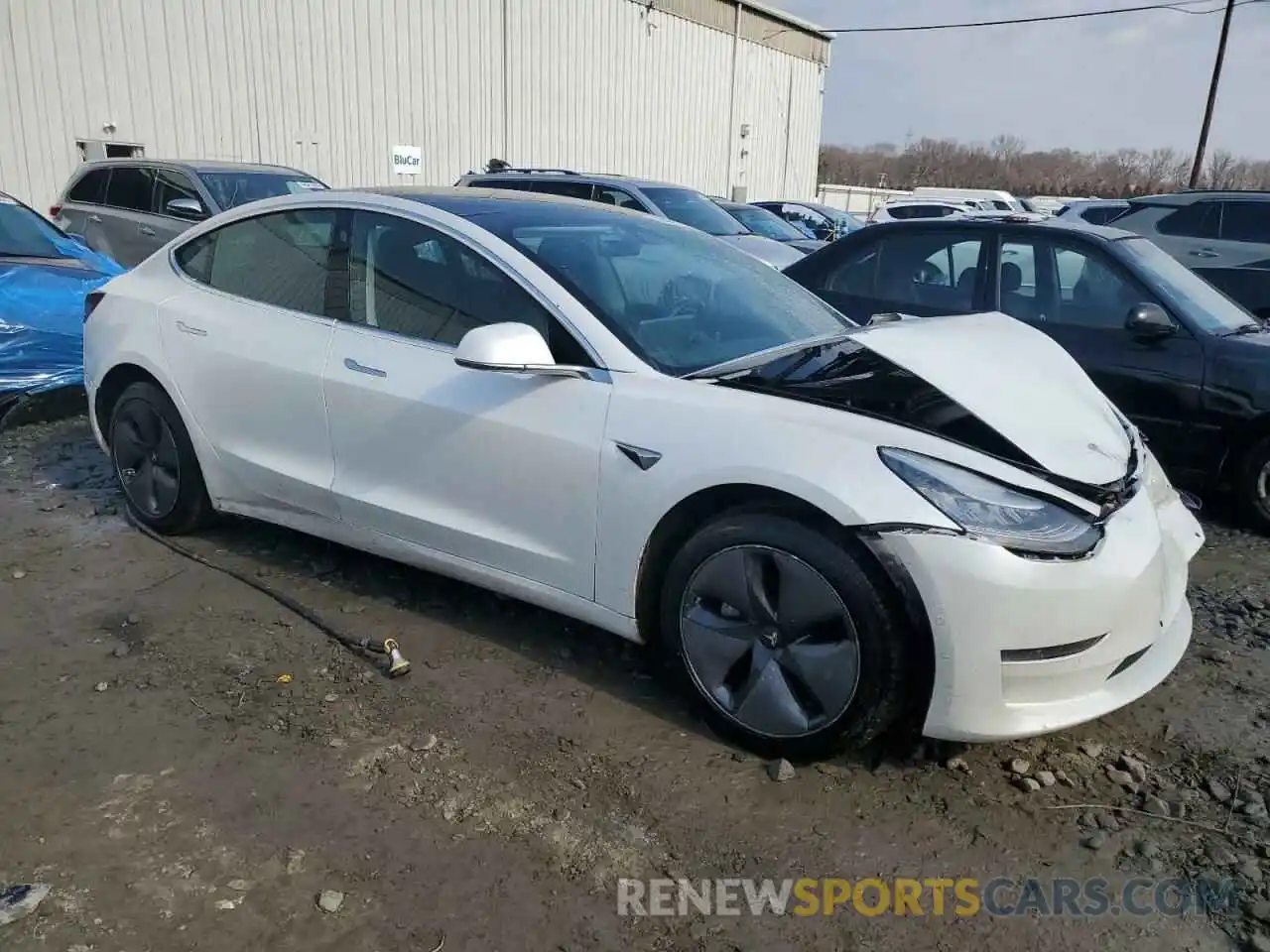 4 Photograph of a damaged car 5YJ3E1EA5LF597724 TESLA MODEL 3 2020