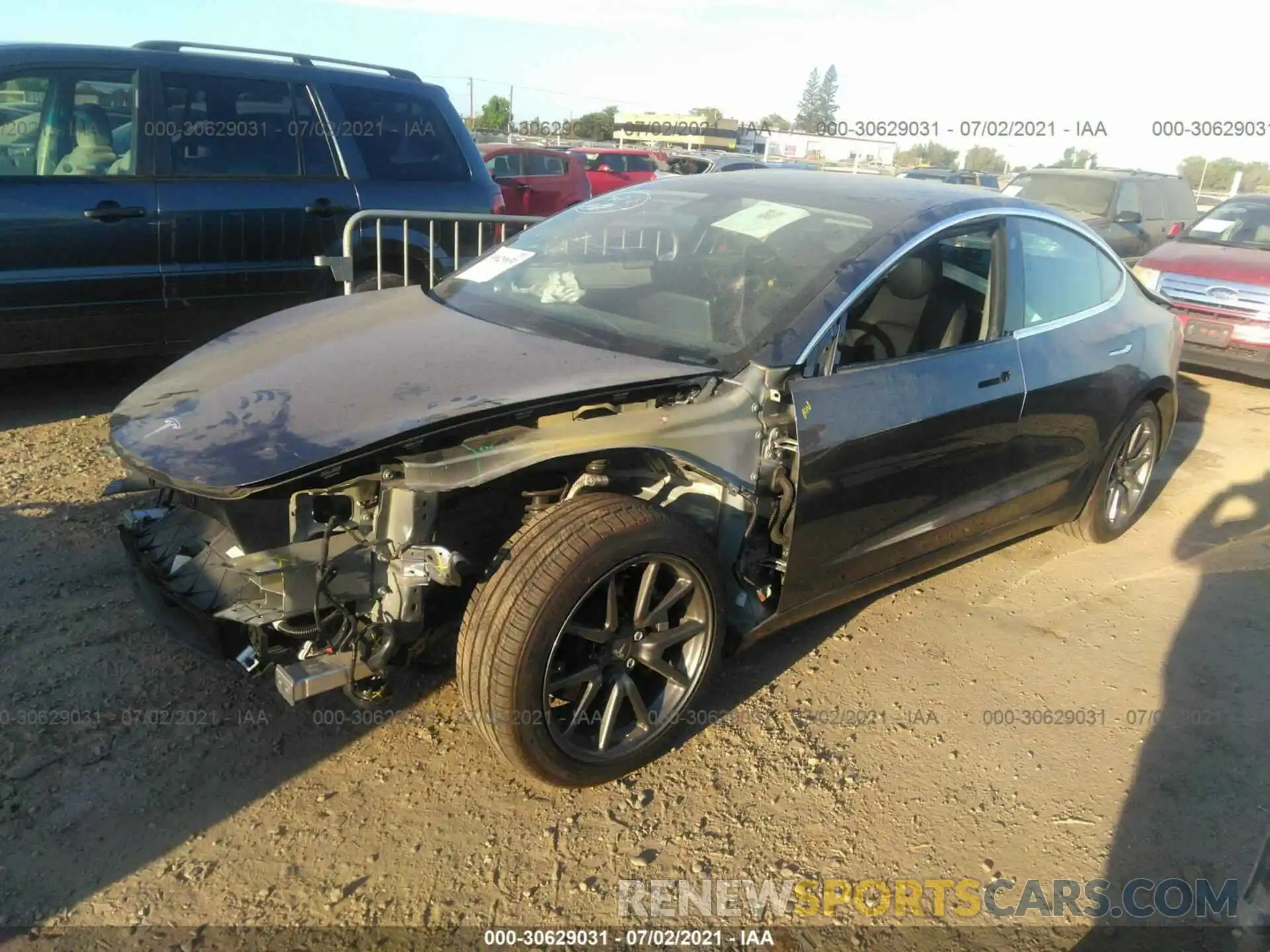 2 Photograph of a damaged car 5YJ3E1EA5LF739392 TESLA MODEL 3 2020