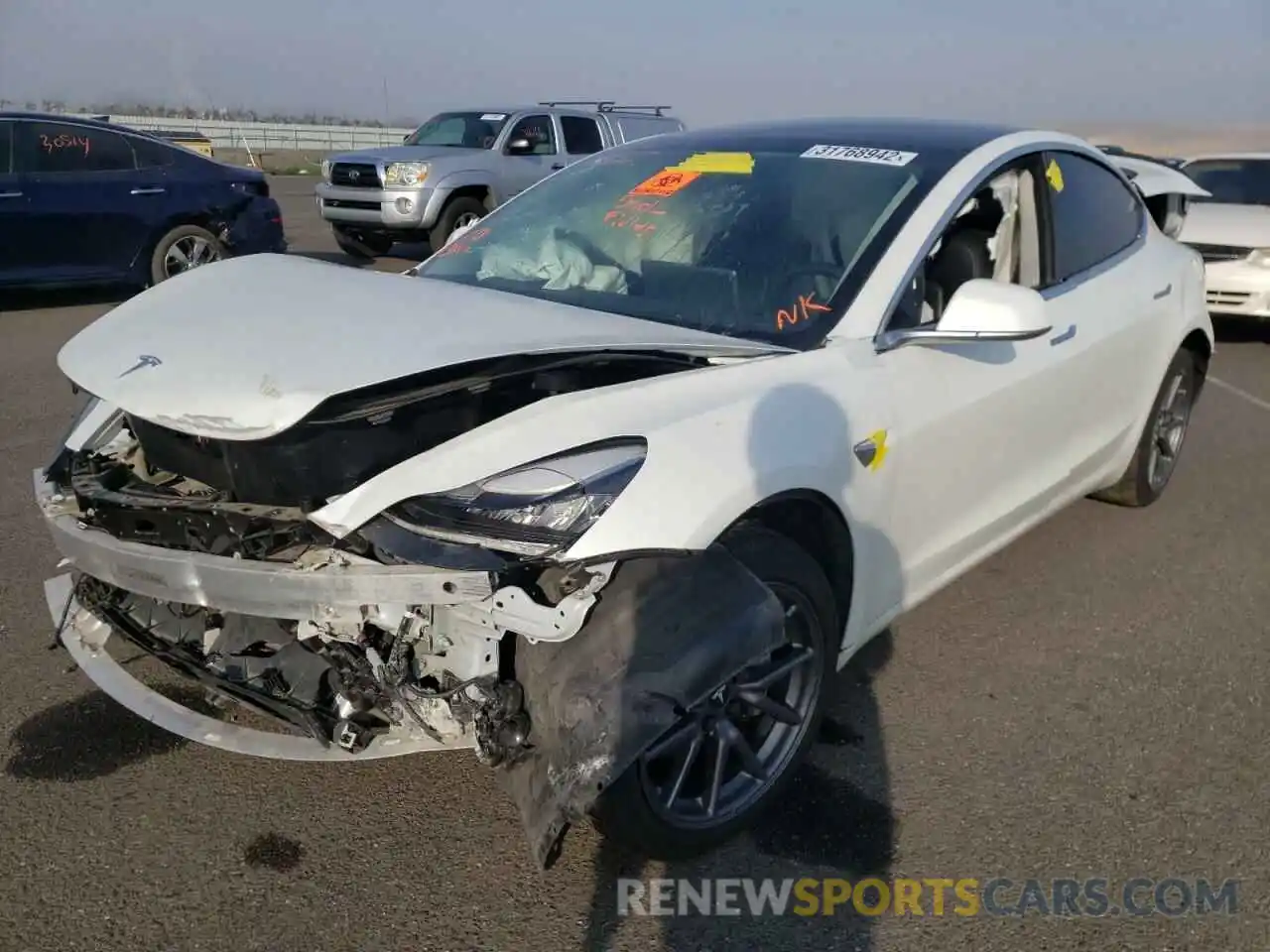 2 Photograph of a damaged car 5YJ3E1EA6LF660653 TESLA MODEL 3 2020