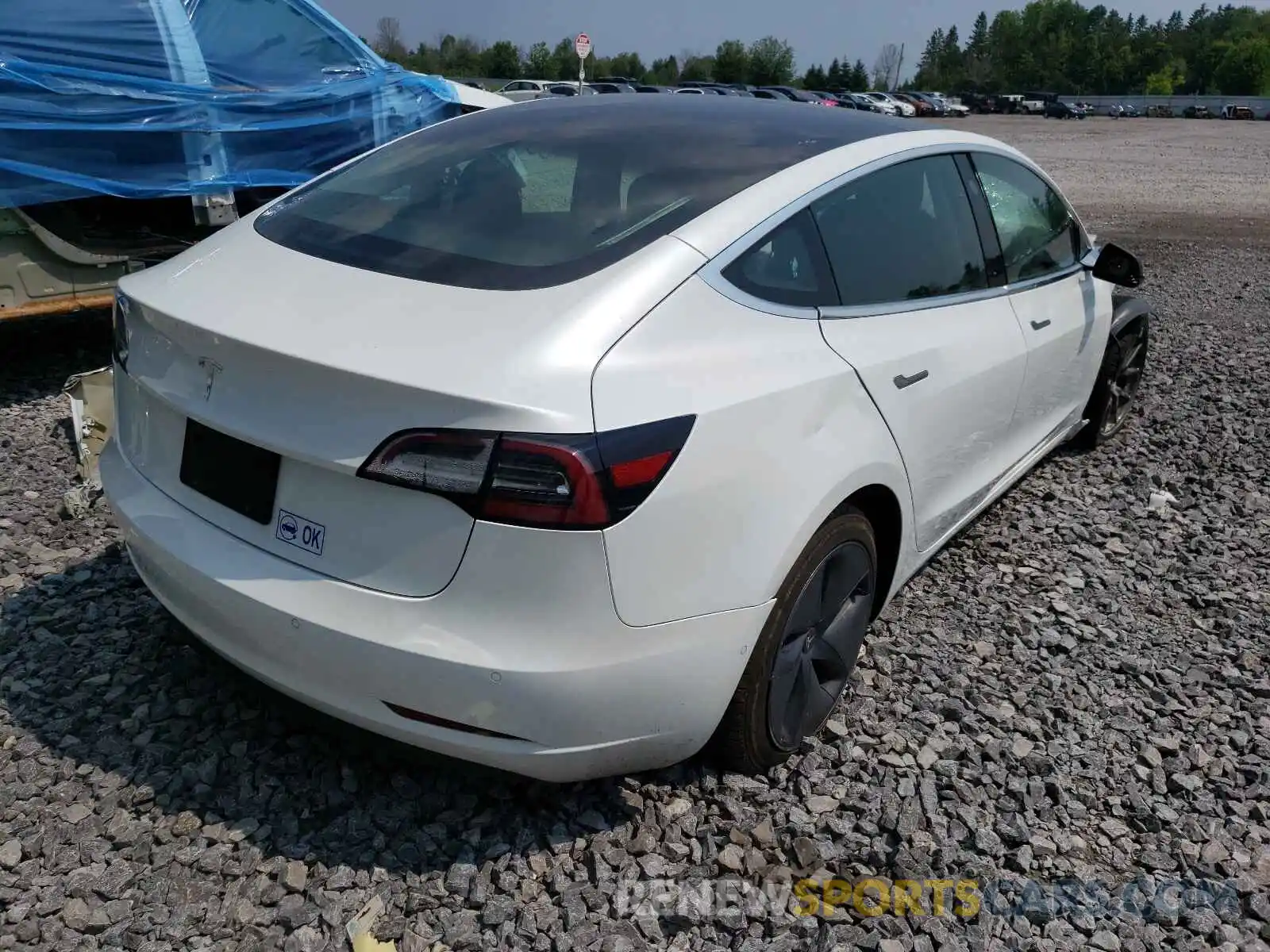 4 Photograph of a damaged car 5YJ3E1EA7LF738843 TESLA MODEL 3 2020