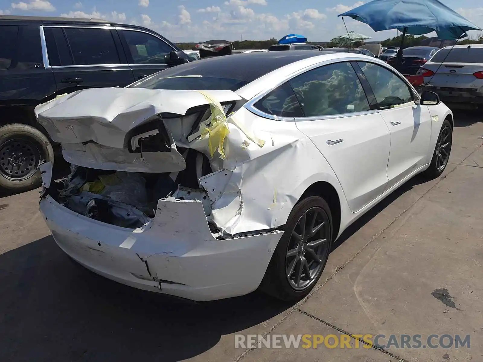 4 Photograph of a damaged car 5YJ3E1EA8LF718150 TESLA MODEL 3 2020