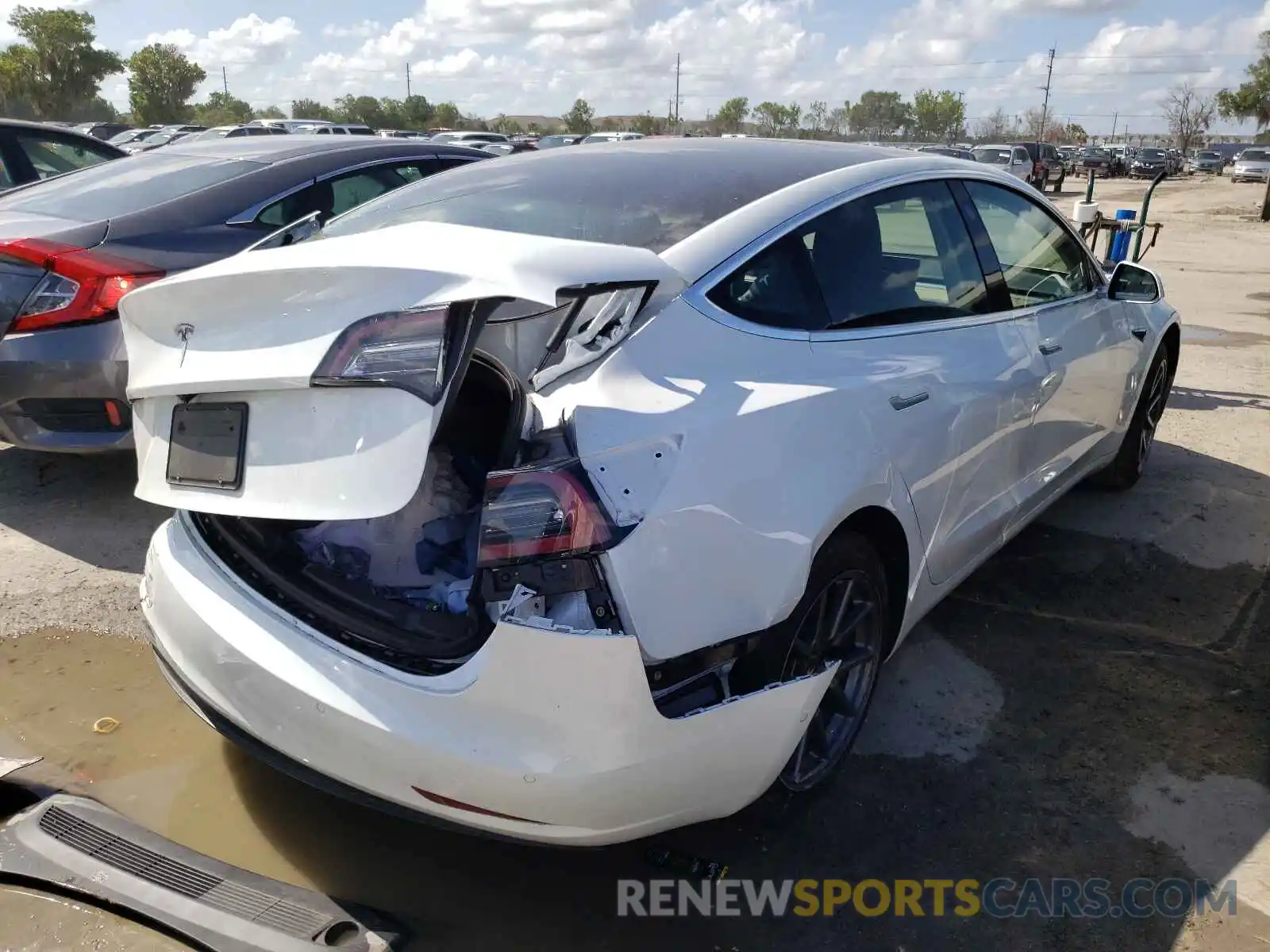 4 Photograph of a damaged car 5YJ3E1EA9LF613679 TESLA MODEL 3 2020