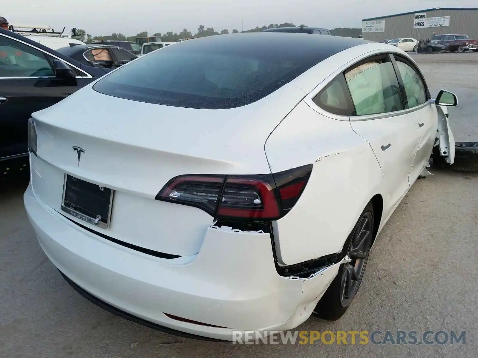 4 Photograph of a damaged car 5YJ3E1EAXLF799779 TESLA MODEL 3 2020