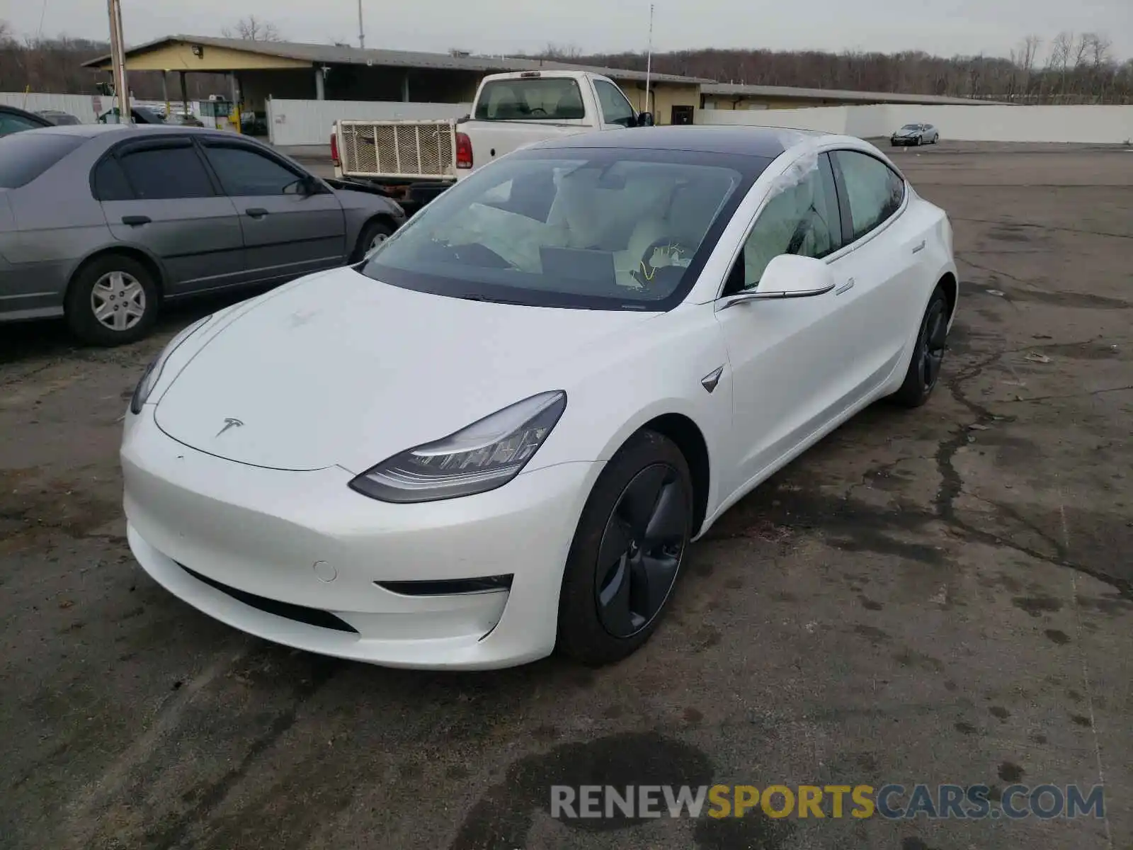 2 Photograph of a damaged car 5YJ3E1EB0LF606998 TESLA MODEL 3 2020