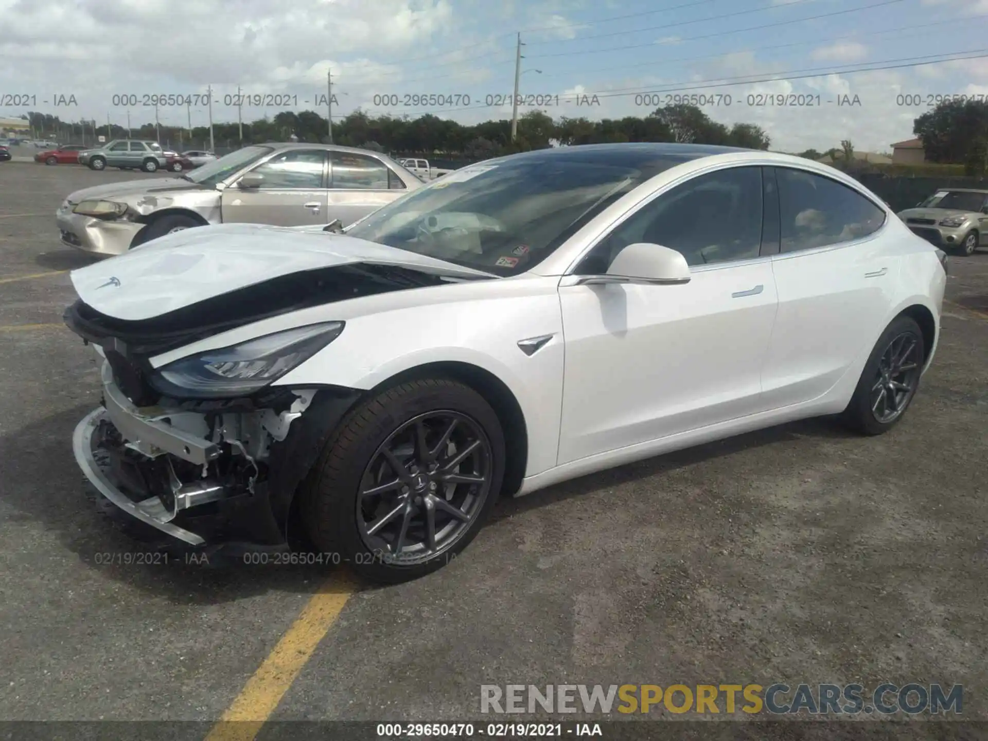 2 Photograph of a damaged car 5YJ3E1EB0LF639497 TESLA MODEL 3 2020