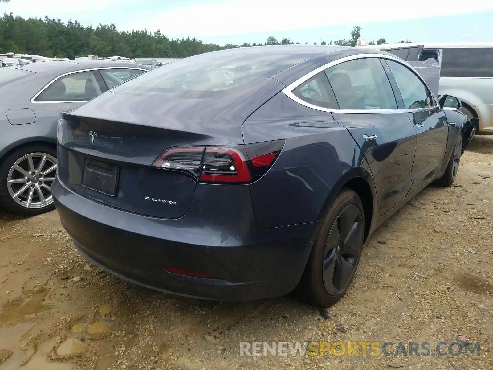 4 Photograph of a damaged car 5YJ3E1EB1LF717429 TESLA MODEL 3 2020