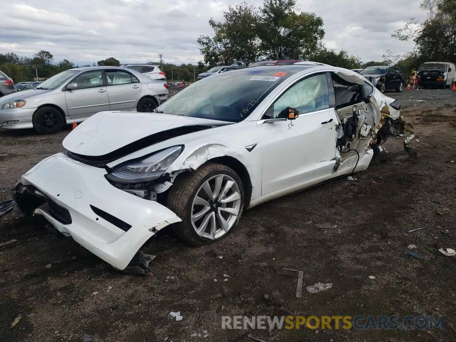 2 Photograph of a damaged car 5YJ3E1EB2LF513593 TESLA MODEL 3 2020