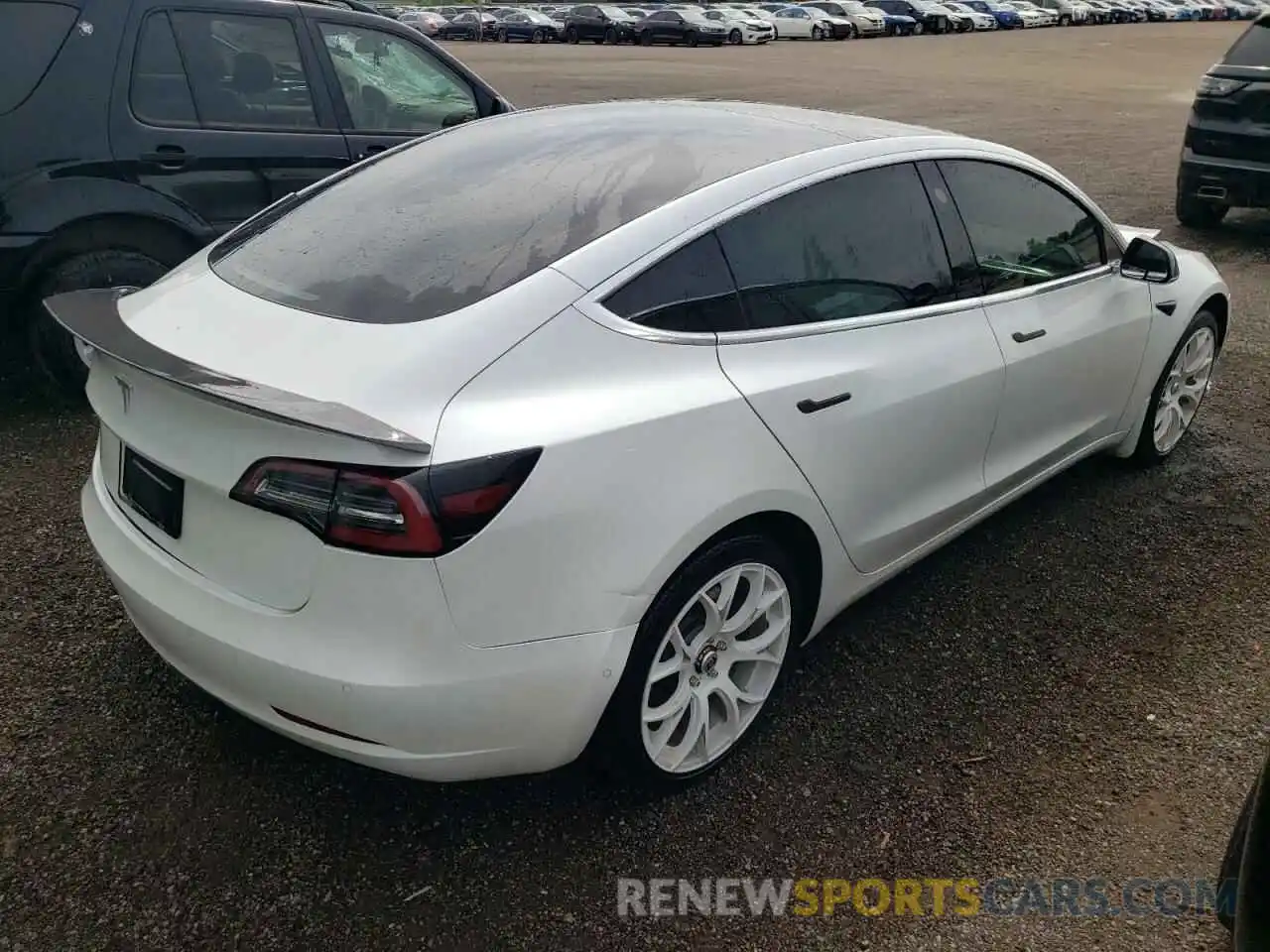 4 Photograph of a damaged car 5YJ3E1EB2LF716435 TESLA MODEL 3 2020