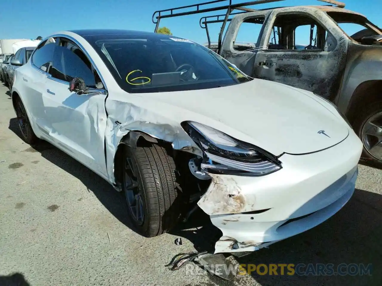 1 Photograph of a damaged car 5YJ3E1EB4LF619401 TESLA MODEL 3 2020