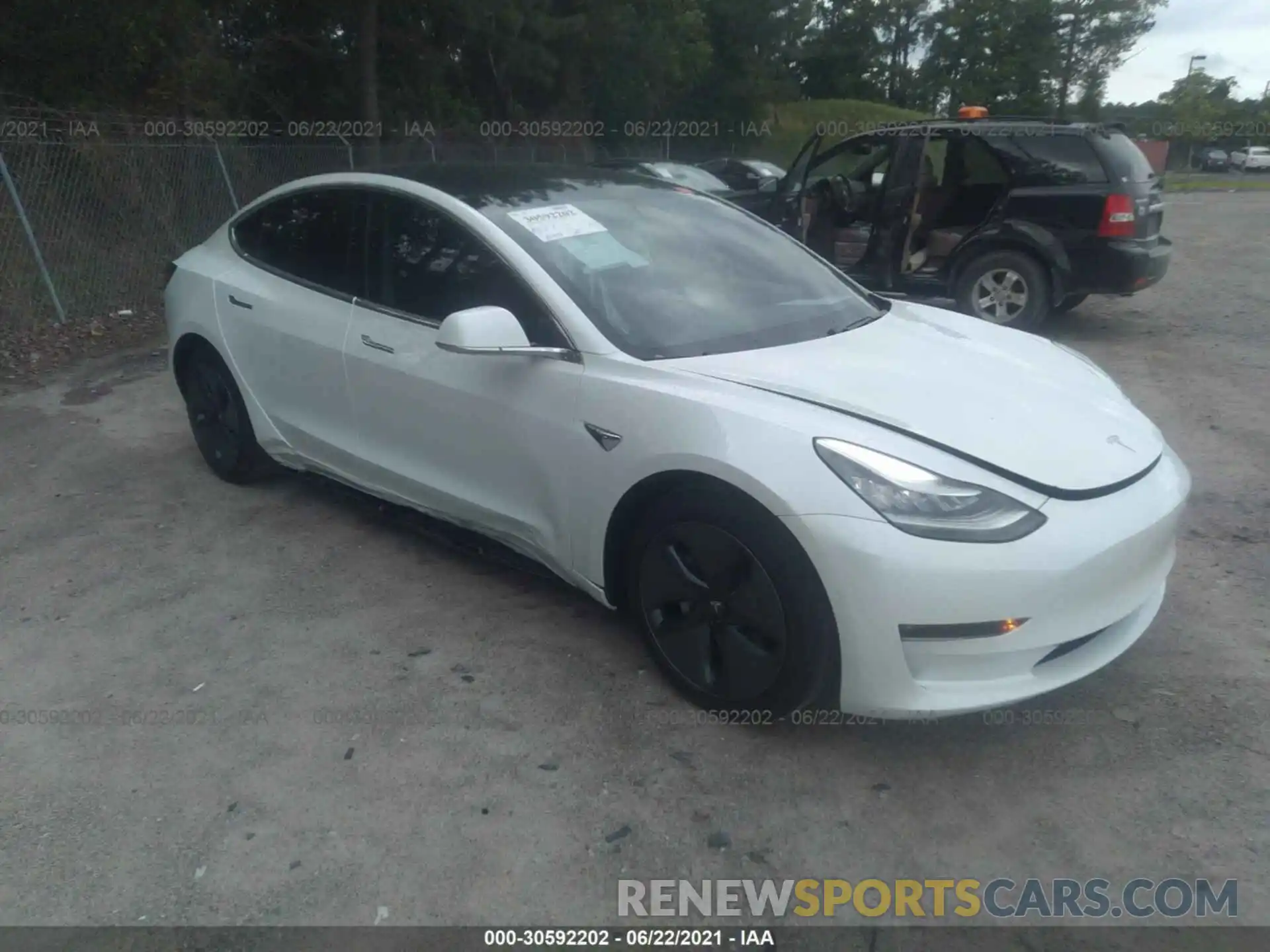 1 Photograph of a damaged car 5YJ3E1EB4LF665598 TESLA MODEL 3 2020