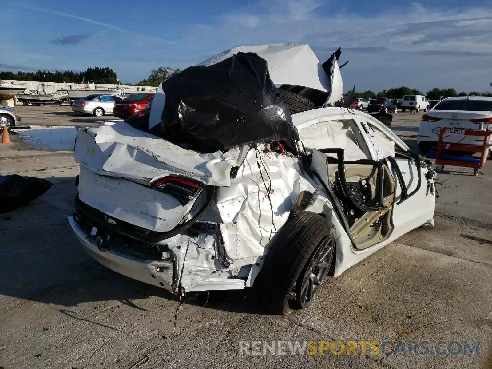 4 Photograph of a damaged car 5YJ3E1EB5LF744424 TESLA MODEL 3 2020