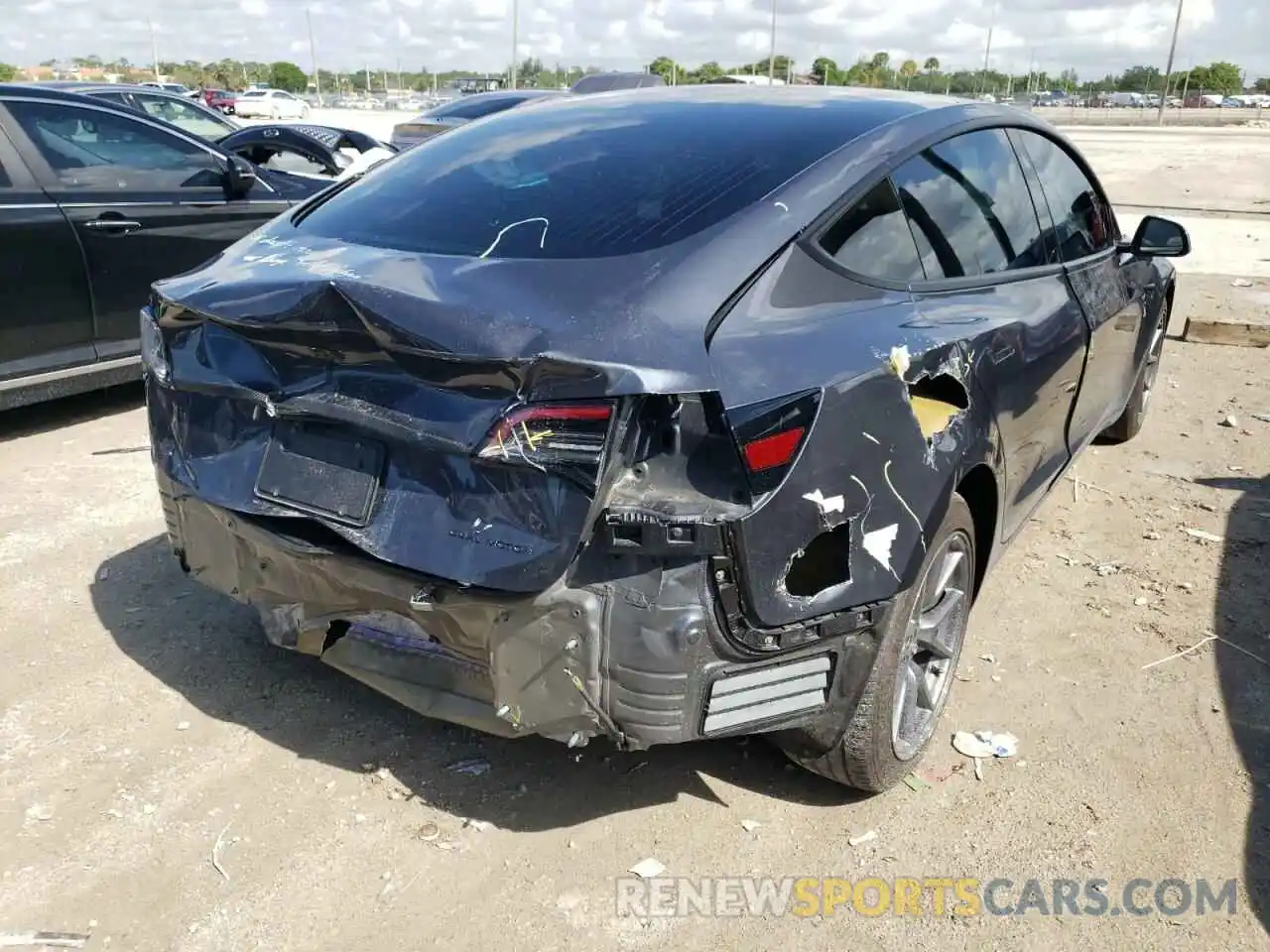 4 Photograph of a damaged car 5YJ3E1EB7LF619893 TESLA MODEL 3 2020