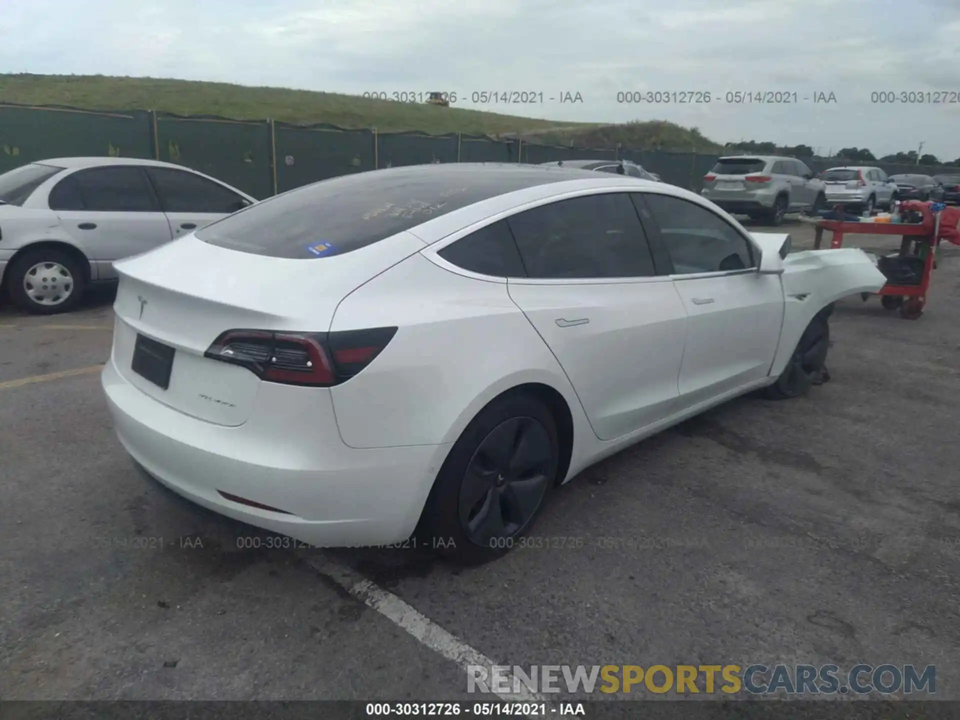 4 Photograph of a damaged car 5YJ3E1EB7LF720156 TESLA MODEL 3 2020