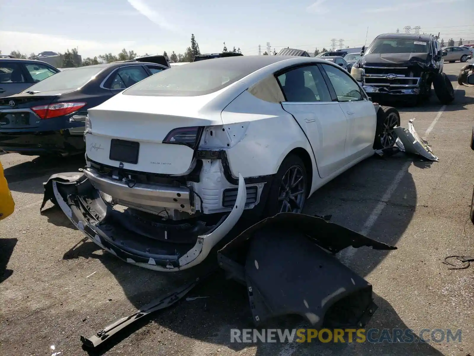 4 Photograph of a damaged car 5YJ3E1EC1LF602001 TESLA MODEL 3 2020