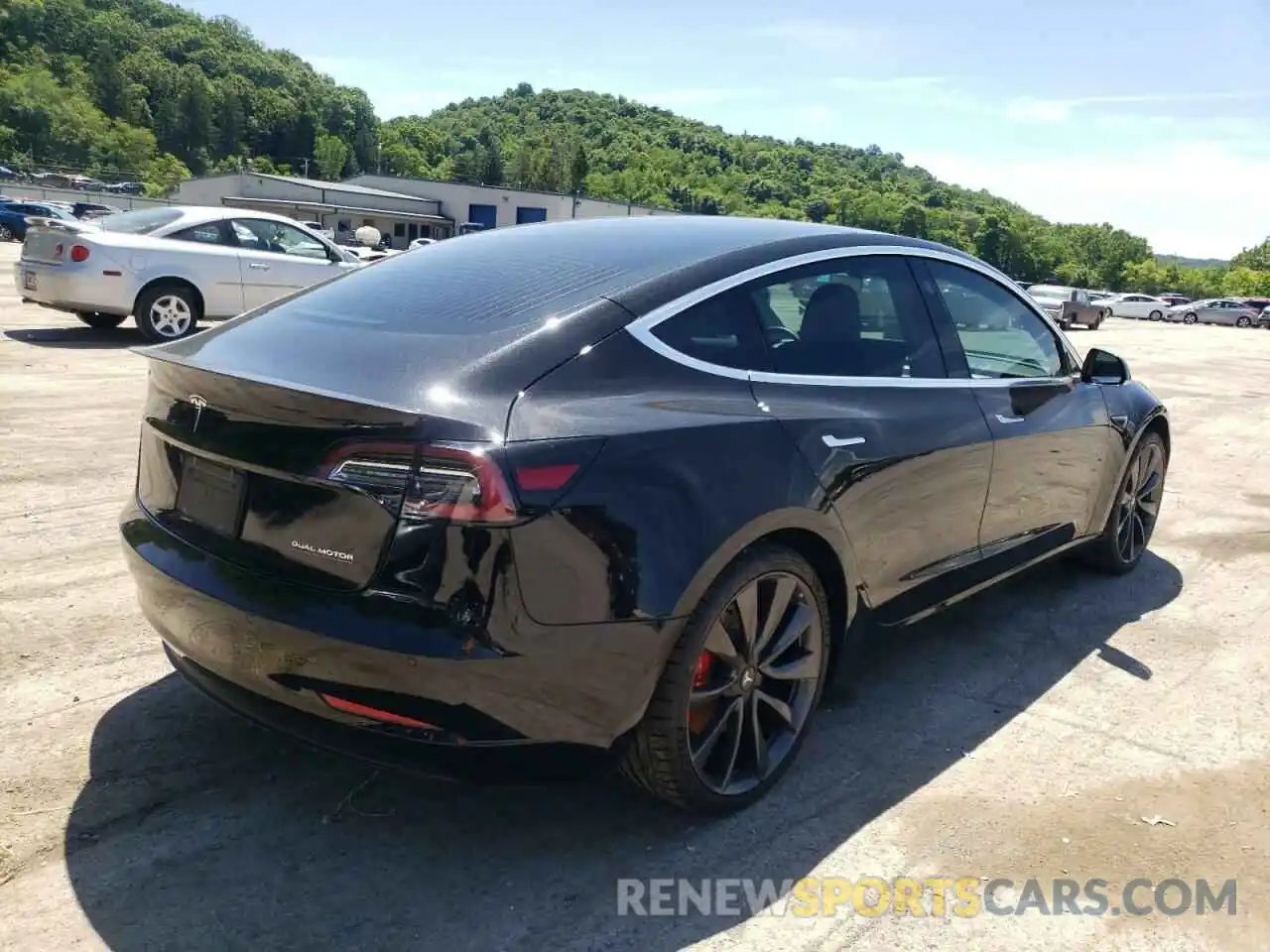 4 Photograph of a damaged car 5YJ3E1EC2LF713141 TESLA MODEL 3 2020