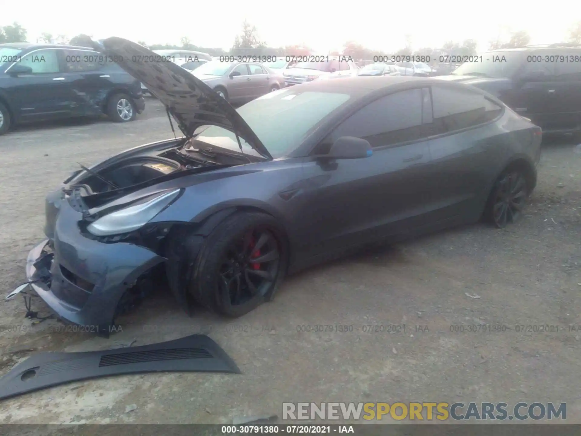 2 Photograph of a damaged car 5YJ3E1EC2LF713558 TESLA MODEL 3 2020