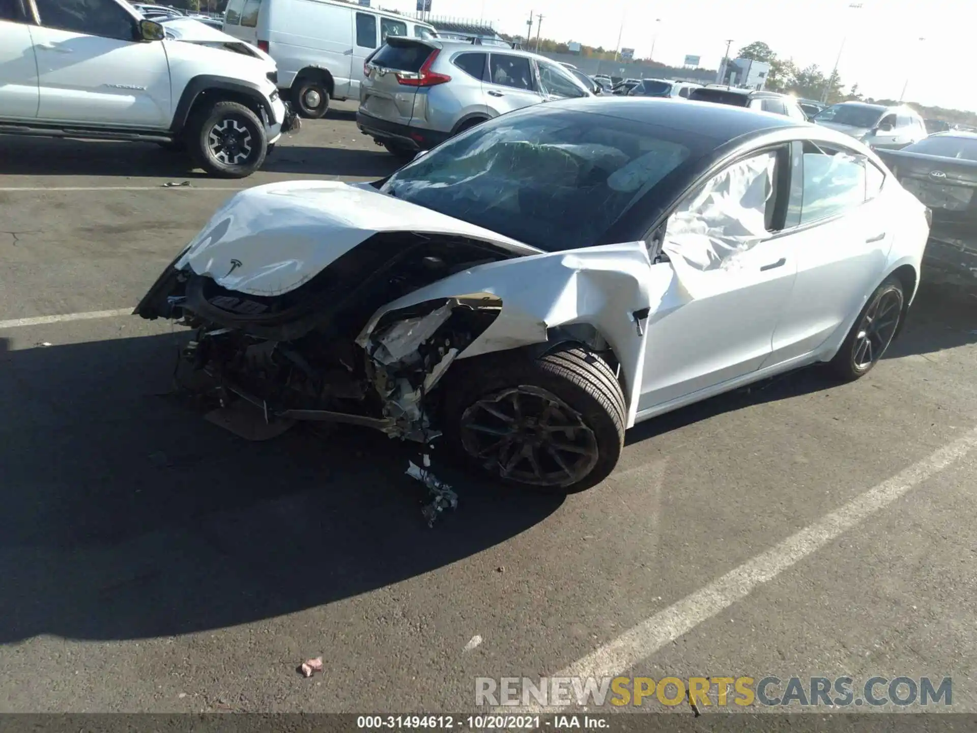 2 Photograph of a damaged car 5YJ3E1EA0MF852104 TESLA MODEL 3 2021