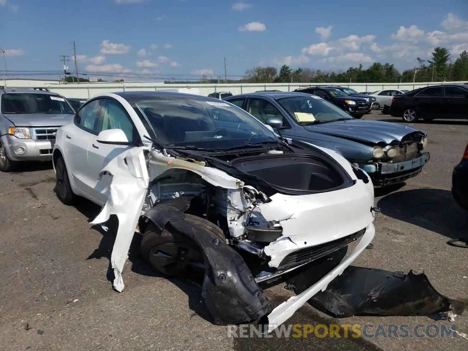 1 Photograph of a damaged car 5YJ3E1EA0MF977412 TESLA MODEL 3 2021