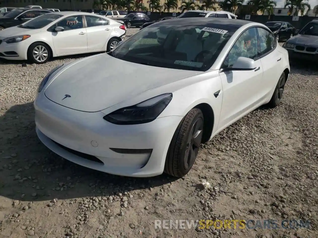 2 Photograph of a damaged car 5YJ3E1EA0MF977975 TESLA MODEL 3 2021