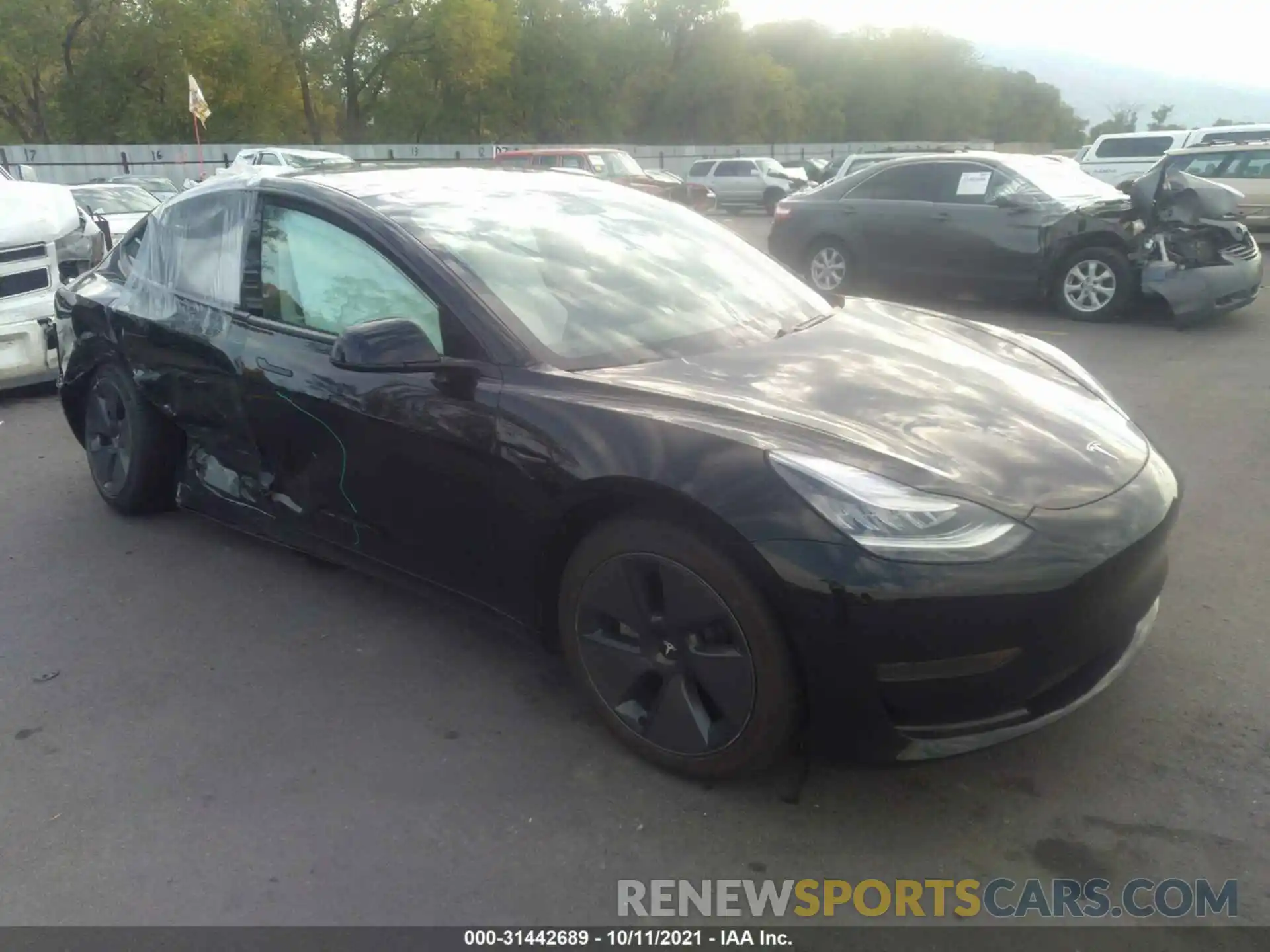 1 Photograph of a damaged car 5YJ3E1EA1MF860020 TESLA MODEL 3 2021