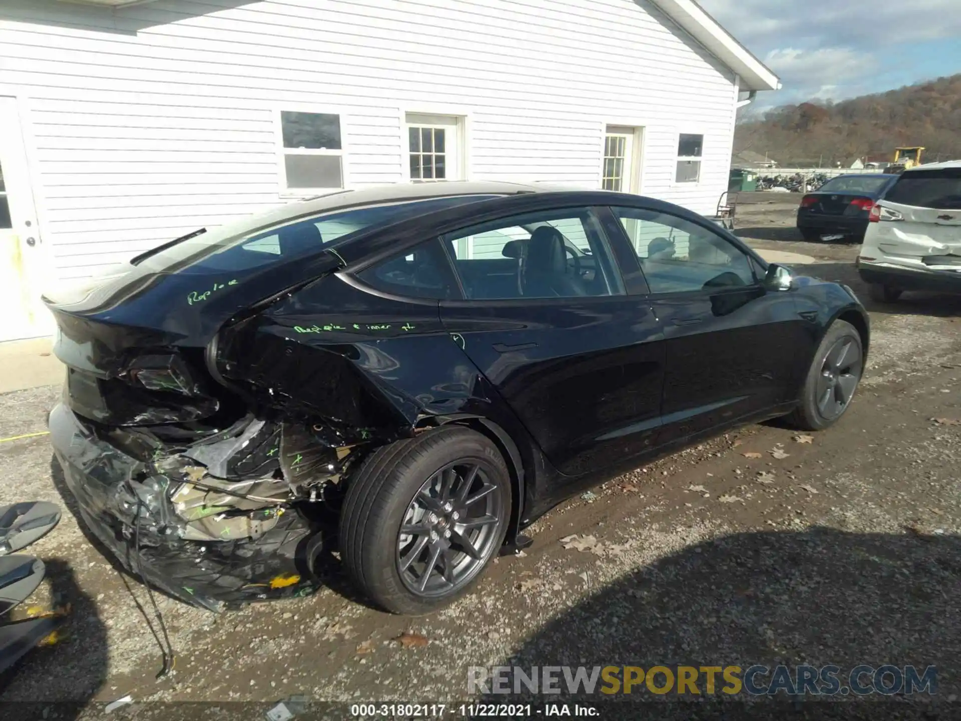 4 Photograph of a damaged car 5YJ3E1EA2MF013569 TESLA MODEL 3 2021