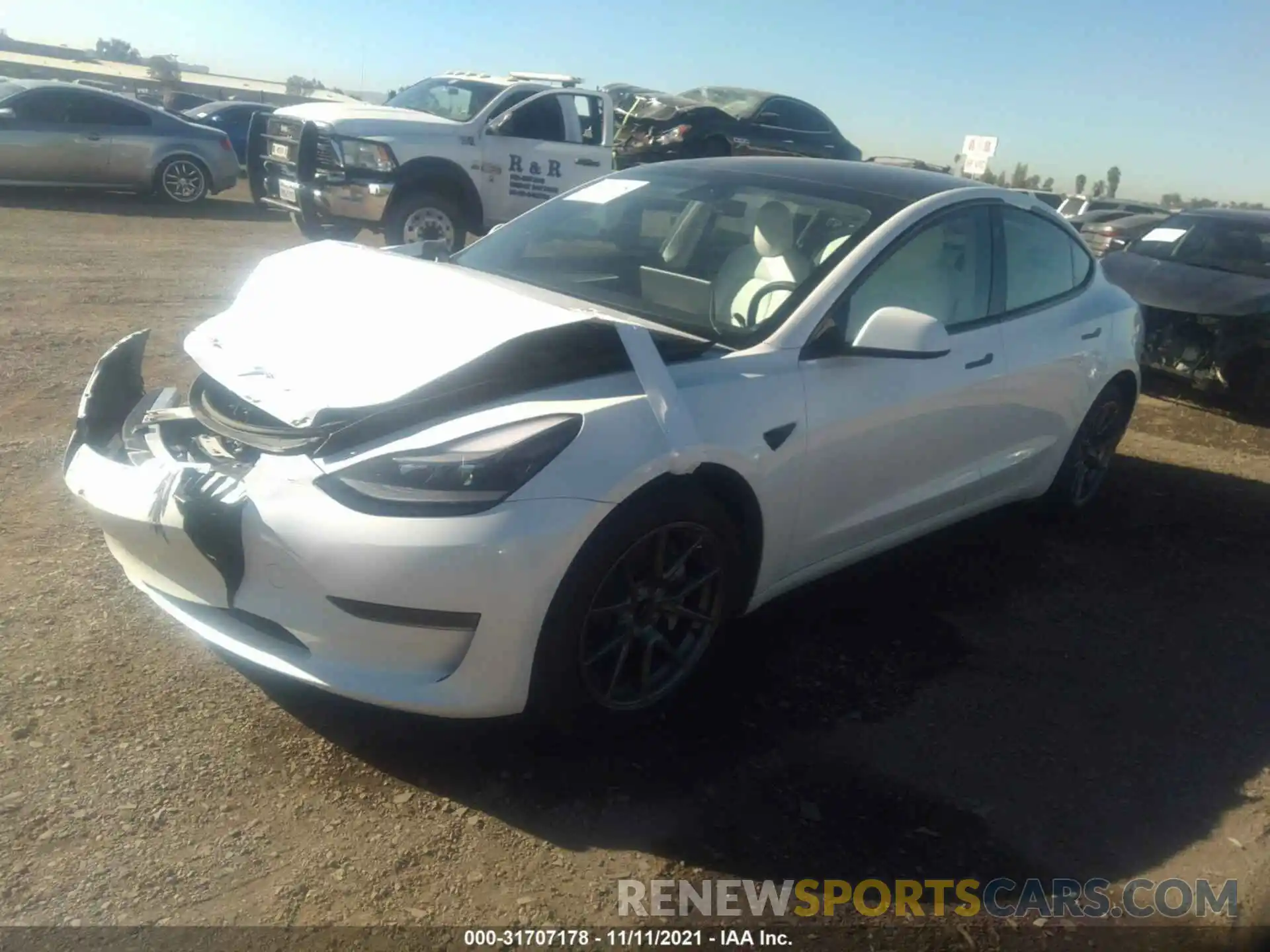 2 Photograph of a damaged car 5YJ3E1EA2MF028816 TESLA MODEL 3 2021