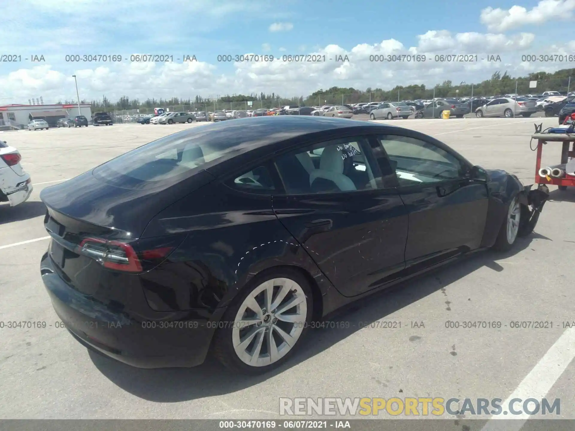 4 Photograph of a damaged car 5YJ3E1EA3MF849908 TESLA MODEL 3 2021