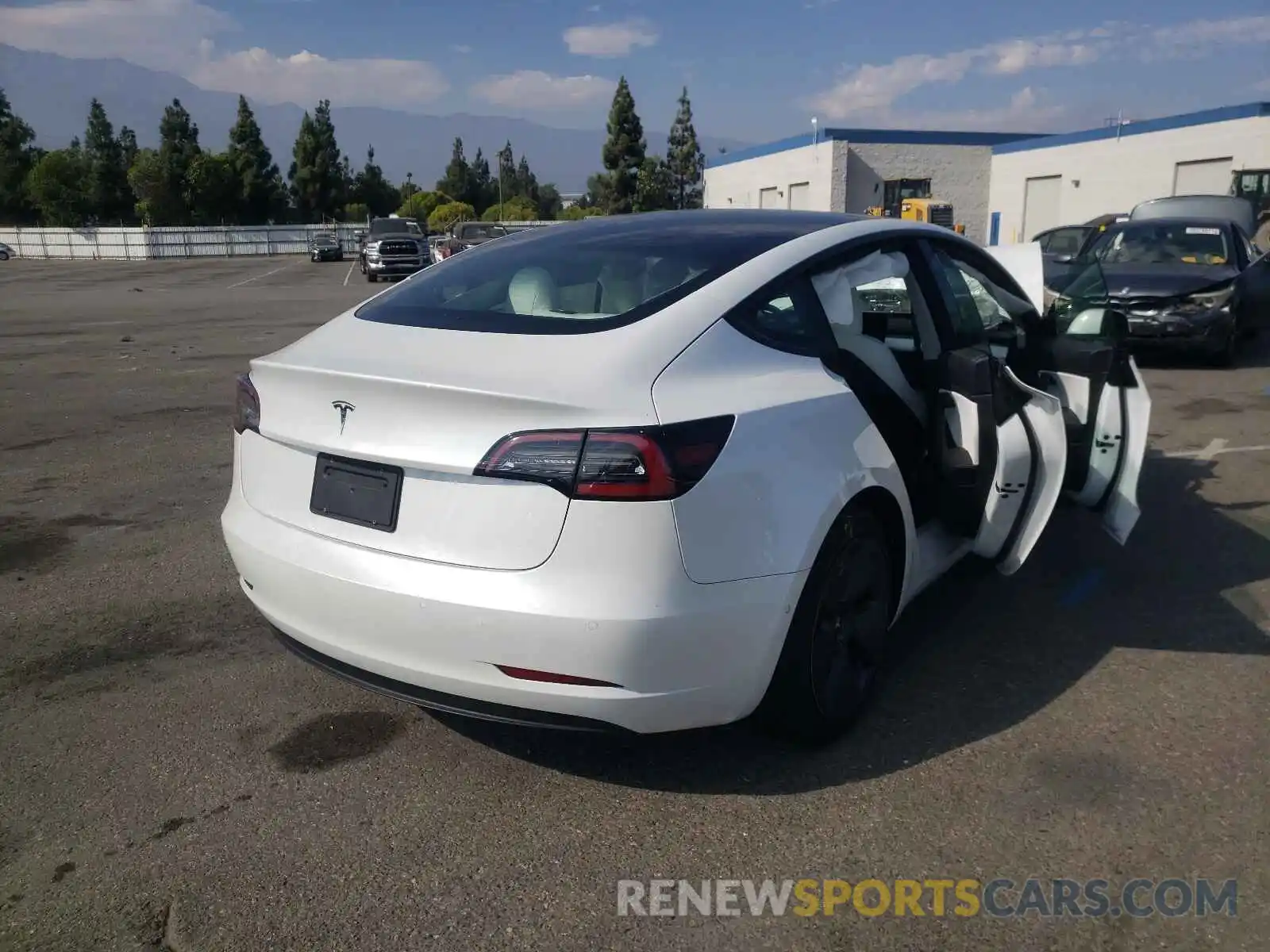 4 Photograph of a damaged car 5YJ3E1EA3MF877885 TESLA MODEL 3 2021