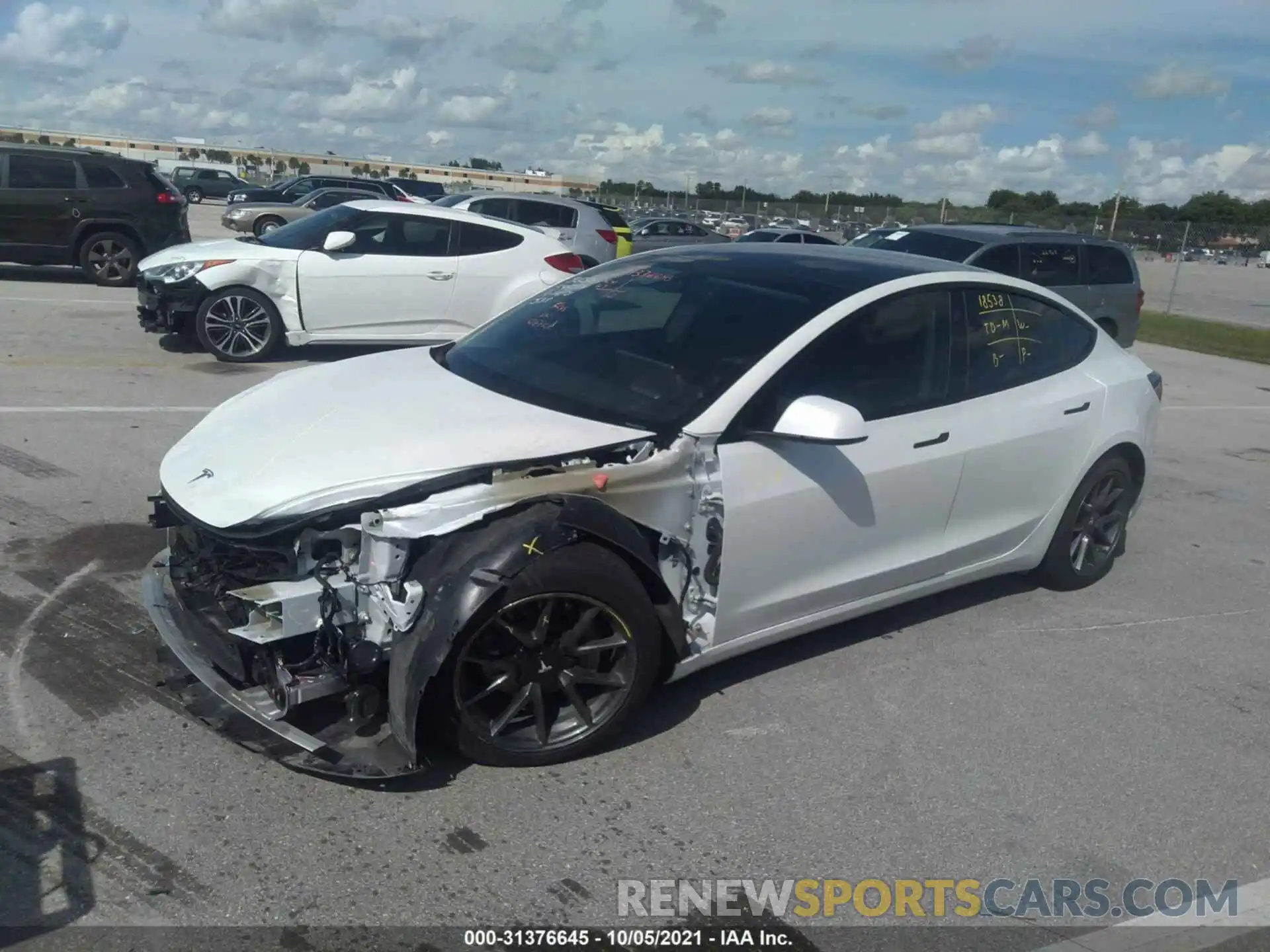 2 Photograph of a damaged car 5YJ3E1EA4MF921165 TESLA MODEL 3 2021