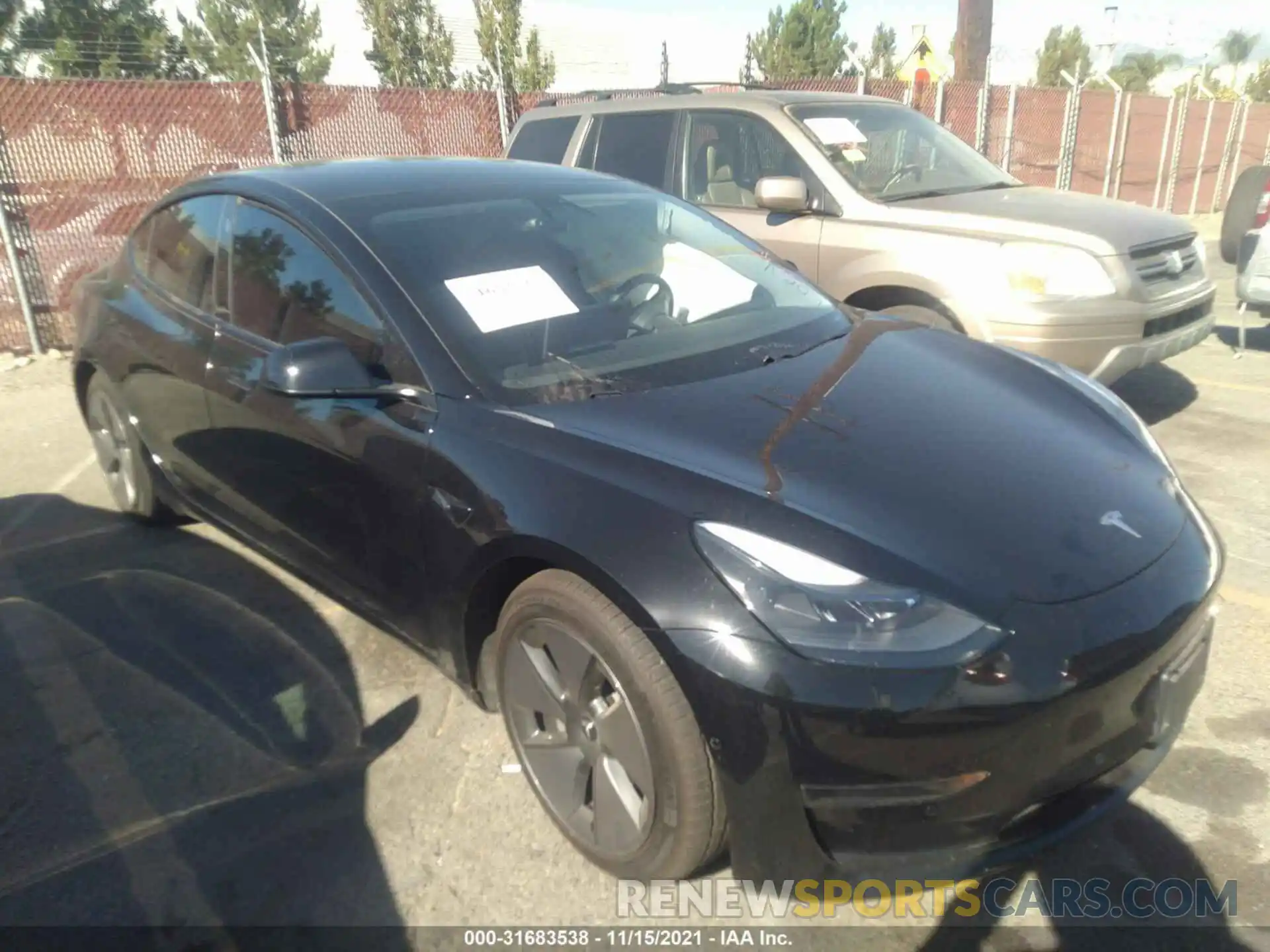 1 Photograph of a damaged car 5YJ3E1EA5MF930263 TESLA MODEL 3 2021