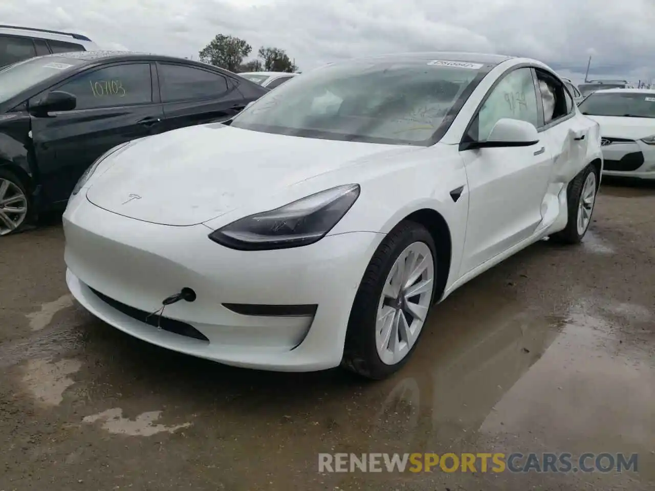 2 Photograph of a damaged car 5YJ3E1EA5MF990852 TESLA MODEL 3 2021