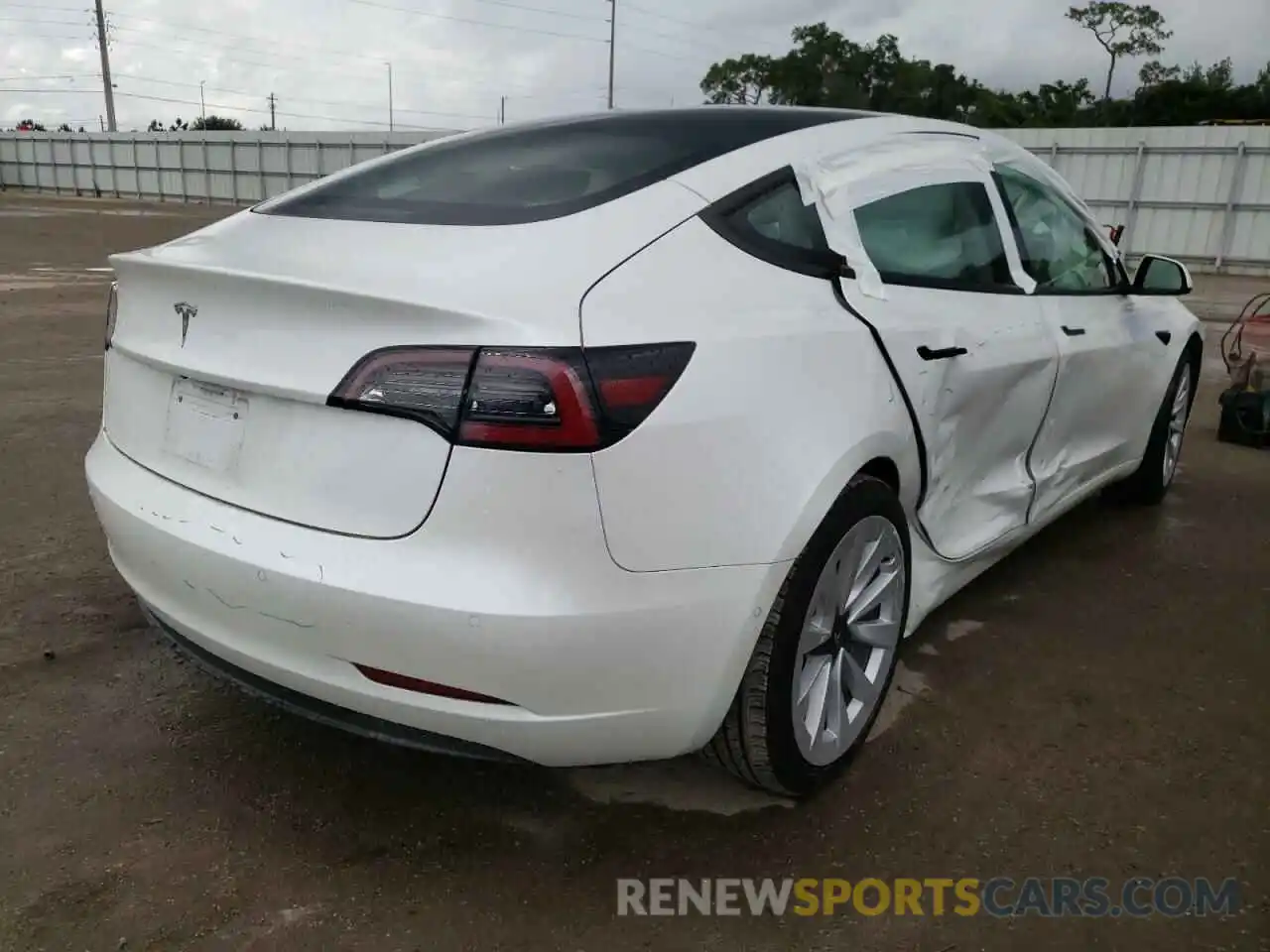 4 Photograph of a damaged car 5YJ3E1EA5MF990852 TESLA MODEL 3 2021